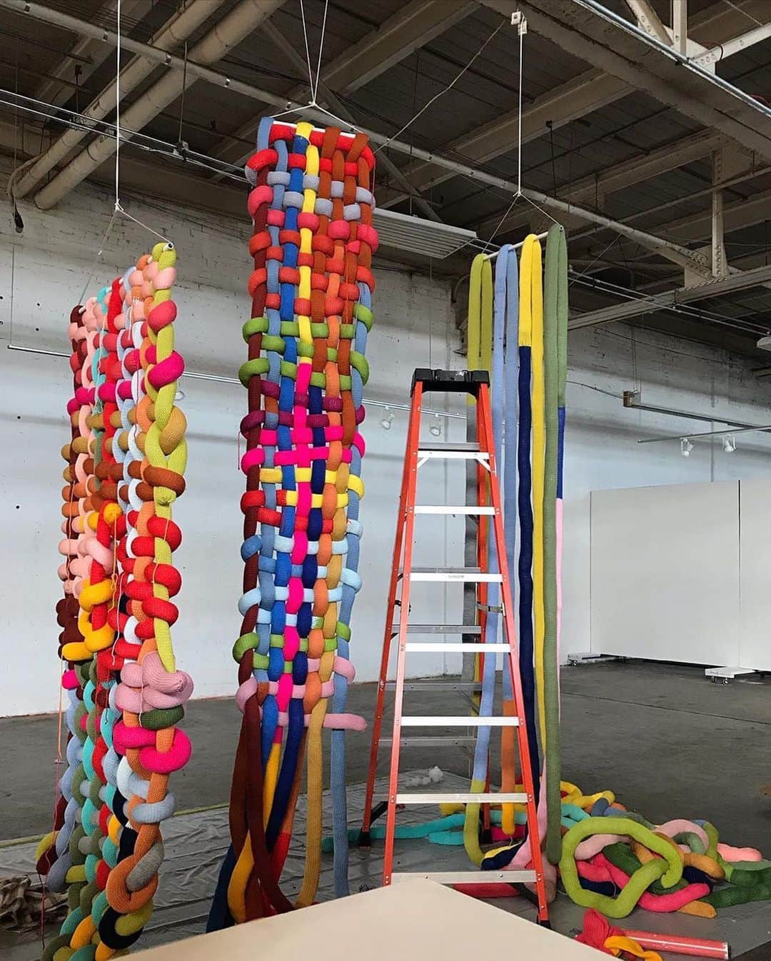 Design Milkさんのインスタグラム写真 - (Design MilkInstagram)「Filing @fiberess's woven #installations under #thingsthatmakeushappy. 🌈  From the artist: "Repairing, Restoring, and Reclaiming ✨🌱💞 As you can see, two of these works are not completely woven as the mending is ongoing. These pieces are magnified versions of a technique called darning. When the threads of a woven fabric become worn or broken, you can mend the area by running stitches in perpendicular directions, weaving them as you go. Covid-19 has highlighted the great need for a mending of culture, policy and being a compassionate human. It’s a long and laborious process towards repairing and healing. Progress is continuous and a finihsed piece doesn’t need to be fully woven 🌱  These pieces will be exhibited at @galleryc3 in Charlotte, NC from Oct 2 to Nov 29."」10月11日 2時34分 - designmilk