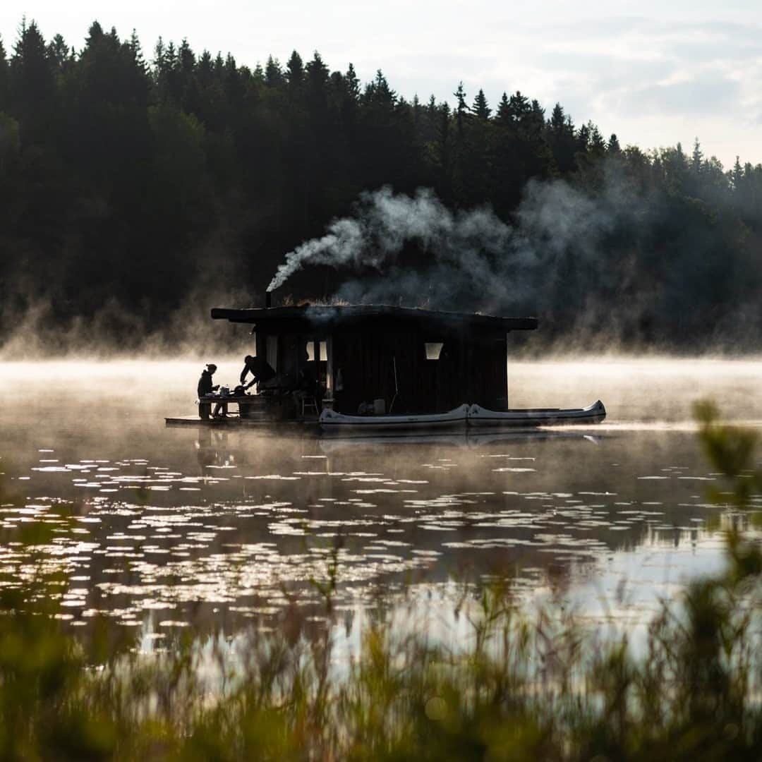 National Geographic Travelさんのインスタグラム写真 - (National Geographic TravelInstagram)「Photo by @MartinEdstrom / People eat on a houseboat hidden on a lake in the deep forests of Värmland, Sweden. It's interesting to hear about the excitement for the growing trend of zero-impact travel—cooking by a fire, sleeping without heating in the room, and using locally sourced foods. This approach of going back to basics has been on the rise for several years. One nature hostel manager I met this summer put it quite bluntly: "Twenty years ago people said I was crazy for not having satellite TV installed. Now they get mad that there's even cell phone reception. They don't want it."⁠ It feels perfectly understandable that people need rest from the modern media and information society these days. At first glance, it feels a little bit like a facade. While you stay at a zero-impact lodge or hostel for a few days, your regular life back home still generates a lot of impact. But perhaps it can help us think about which parts of our lives we could do without, or how we could reduce impact at home. If that's the only result in the end, it's still something.⁠  Follow @MartinEdstrom for more travel tips from Sweden and the Nordics. #exploringhome #sweden #nordics #morninglight #lakeside」10月11日 21時08分 - natgeotravel