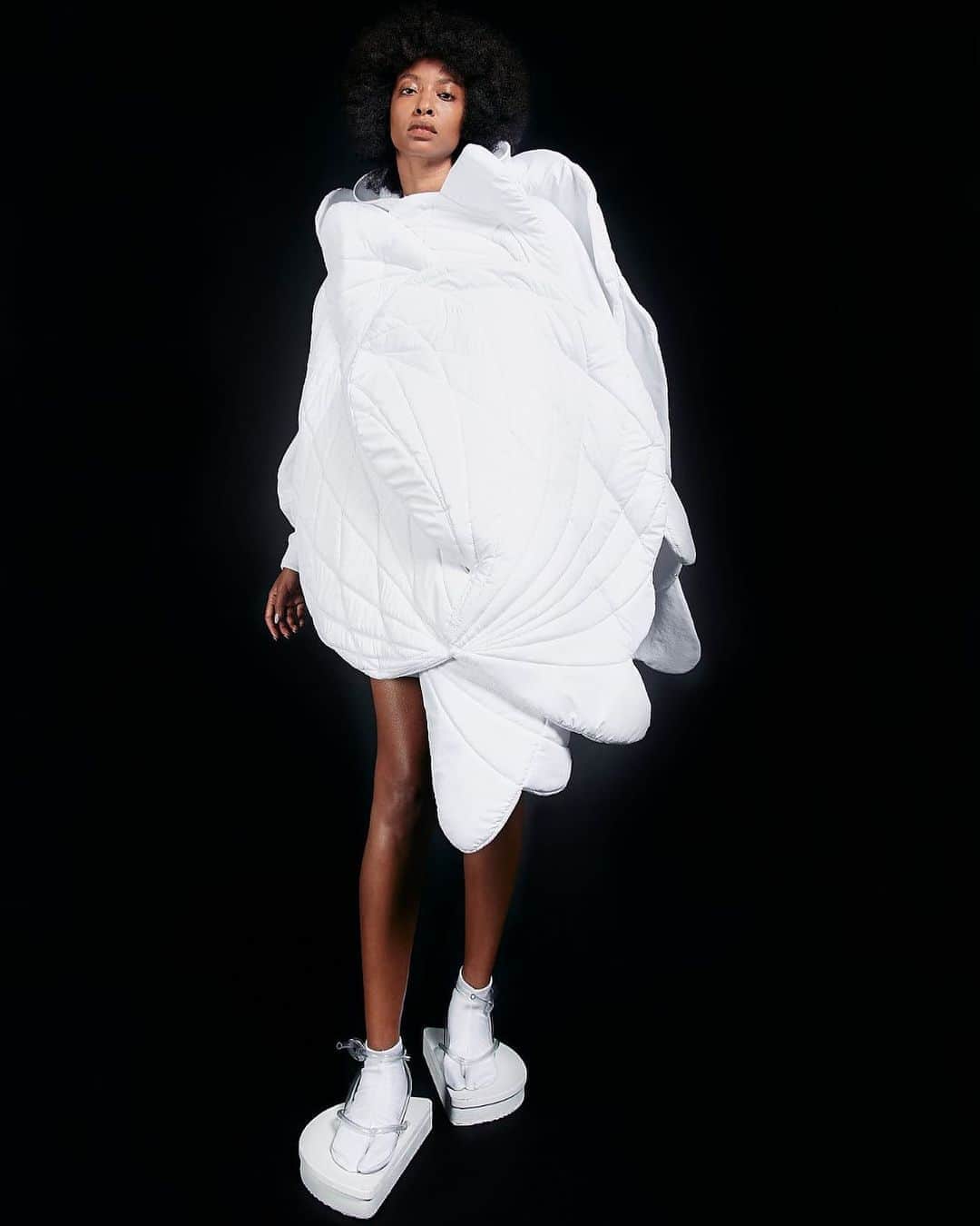 スリーアズフォーのインスタグラム：「Our New collection “Vesica Piscis” is out on @voguerunway  Photographer : Elisabet Davids @elisabet_davidsdottir @elisabetd  Model: @kalah_christina  Stylist : Victoria Bartlett @victoria_bartlett_nyc  Hair: Kenta Koda @kenta.koda  Makeup: Chichi Saito @chichisaito #threeasfour @threeasfour」
