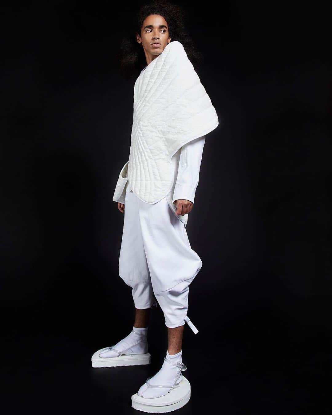 スリーアズフォーのインスタグラム：「Our New collection “Vesica Piscis” is out on @voguerunway  Photographer : Elisabet Davids @elisabet_davidsdottir @elisabetd  Model: Joseph Gelpi @chicojoseph at Ford Models  @fordmodels  Stylist : Victoria Bartlett @victoria_bartlett_nyc  Hair: Kenta Koda @kenta.koda  Makeup: Chichi Saito @chichisaito #vesicapiscis」