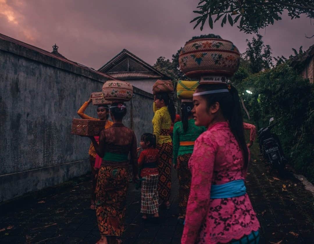 National Geographic Travelさんのインスタグラム写真 - (National Geographic TravelInstagram)「Photo by @joshuacogan / As we wandered through some of the villages on the outskirts of Ubud, we began to see a different way of life that felt more connected to the older ways of being—before the rapid transformation that booming tourism brought to this area of the island. I was grateful to witness this beautiful procession to a ceremony. As dusk set in, the women's blouses danced in the last light of the day.  For more images of rituals and celebrations throughout the world, follow me @joshuacogan. #bali #ubud」10月12日 23時37分 - natgeotravel