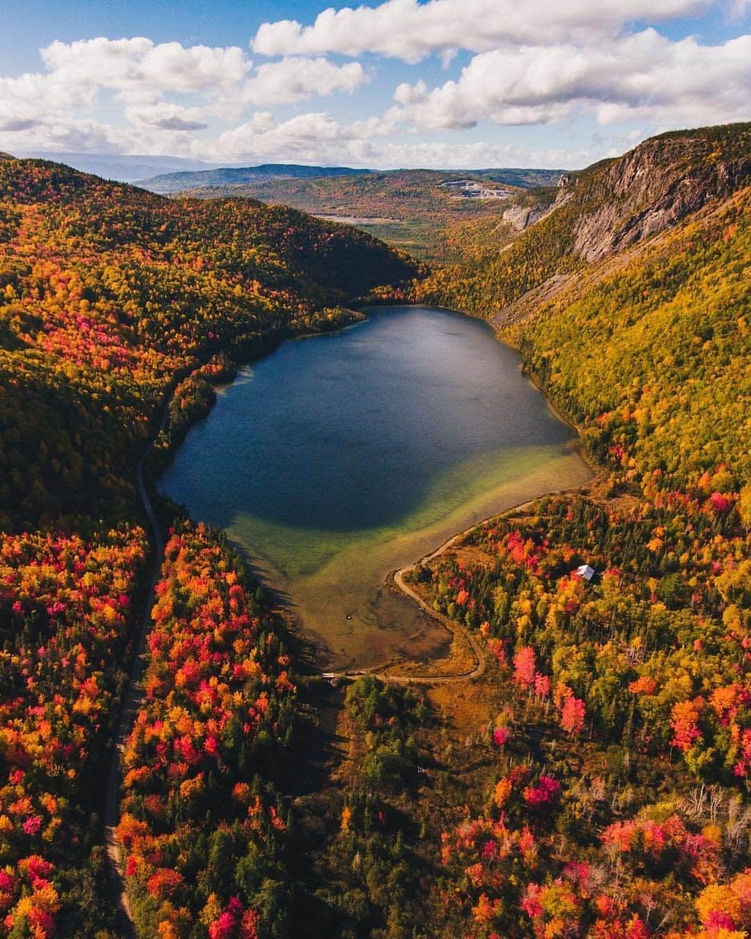 Explore Canadaさんのインスタグラム写真 - (Explore CanadaInstagram)「Fall dreams really do come true. 🍂 This vibrant landscape was captured just outside of Marble Mountain Resort in Newfoundland and Labrador. In a few months these mountains will be covered in snow, but until then, enjoy the fiery display of colours! #ExploreCanada #CanadaNice⁠ ⁠ *Know before you go! Check the most up-to-date travel restrictions and border closures before planning your trip and if you're travelling in Canada, download the COVID Alert app to your mobile device.*⁠ ⁠ 📷: @TomCochrane⁠ 📍: @newfoundlandlabrador⁠ ⁠ #ExploreNL⁠」10月13日 0時02分 - explorecanada