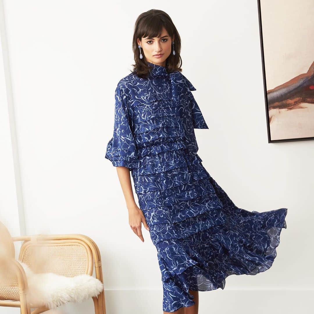 のインスタグラム：「The all-over floral print in shades ranging from periwinkle to navy is the backdrop for an elegant silhouette that features tiers of soft ruffles, a hidden elastic waist, collapsed balloon sleeves, and a self-tie bow at the neckline. - #sachinandbabi #newarrivals #fall2020」