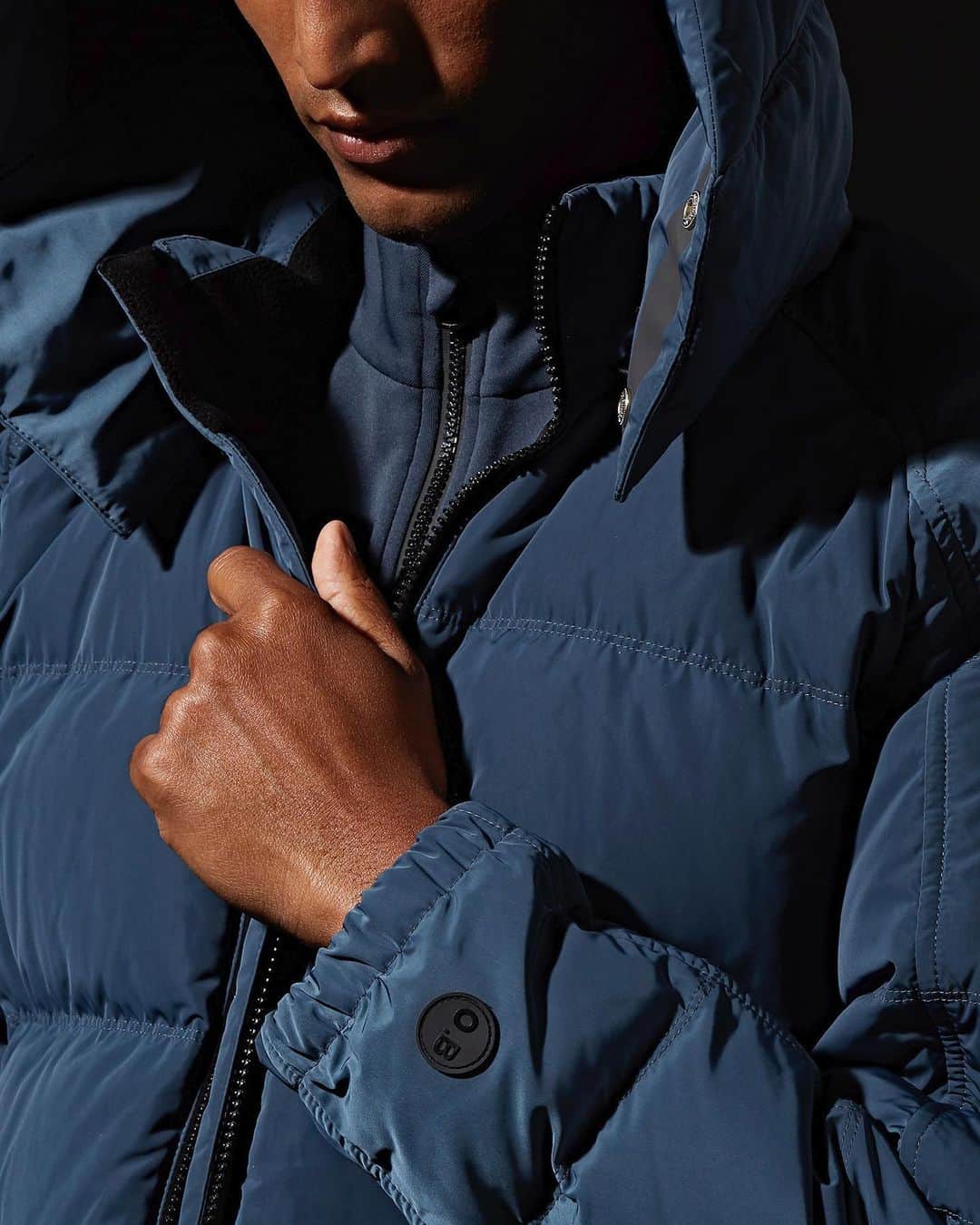 オールバーブラウンのインスタグラム：「Brace up and tap to shop the Ritter jacket from our new #Shark collection. It will keep you warm and dry on your next adventure owing to its responsibly sourced 650-fill power down, detachable hood & weather-resistant fabric. 🦈 #DoseOfSun #OrlebarBrown #OBsAroundTheWorld」