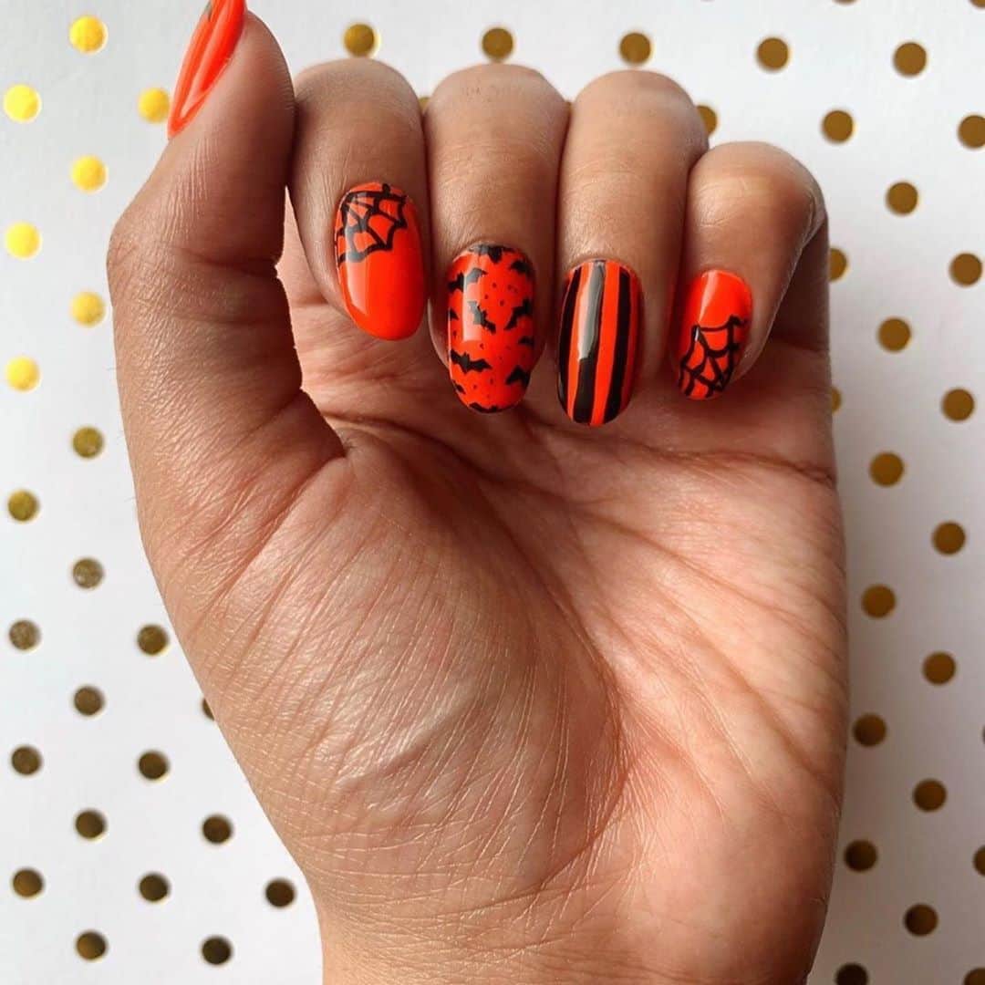 Nail Designsさんのインスタグラム写真 - (Nail DesignsInstagram)「Credit: @nailsbymyrah  ・・・ Hi everyone! Here is my first Halloween mani of the season! This color is a bit out of the ordinary for me, but I thought it would be just perfect for this Halloween design!   Let me know what you think in the comments 🧡🧡🧡  Polishes Used:  Orange/Saviland: "Kawaii Orange"  Black/Maniology: "Straight Up Black"  Topcoat/Saviland: "Diamond Topcoat"  Base Coat/ÜNT: "Ready for Takeoff Peelable Base Coat"  #fall #fallvibes #fallnails #halloween #halloweennails #bats #web #stripes #gelnails #gelmanicure #gelpolish #orange #black #nails #nailsofinstagram #nailart #nail #nailsoftheday #naildesigns #nailinspo #nailinspiration #nails2inspire #naildesign #nailideas #nailartist #nailaddict #nailpolish #nailsonfleek #nailsofig #manicure」10月15日 1時53分 - nailartfeature