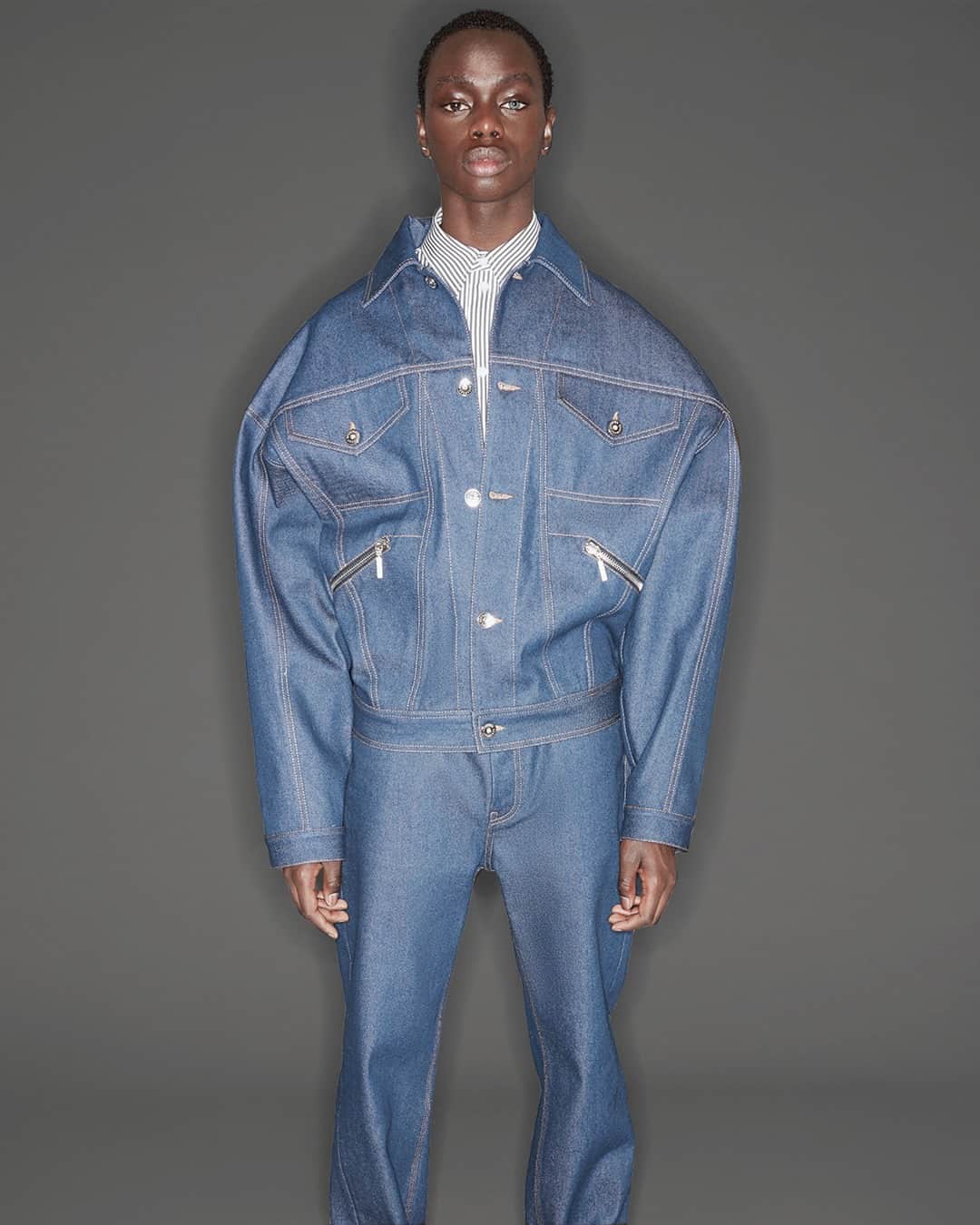 オープニングセレモニーのインスタグラム：「From our FW20 collection: Long sleeves denim jacket in blue with Opening Ceremony box logo printed on the back. Shop this style on openingceremony.com⁠ ⁠ 📸 by @julienmartinezleclerc / styling by @nathankleinstyling/ hair by @pierresaintsever / make-up by #cecileparavina / model @prince_coulio」