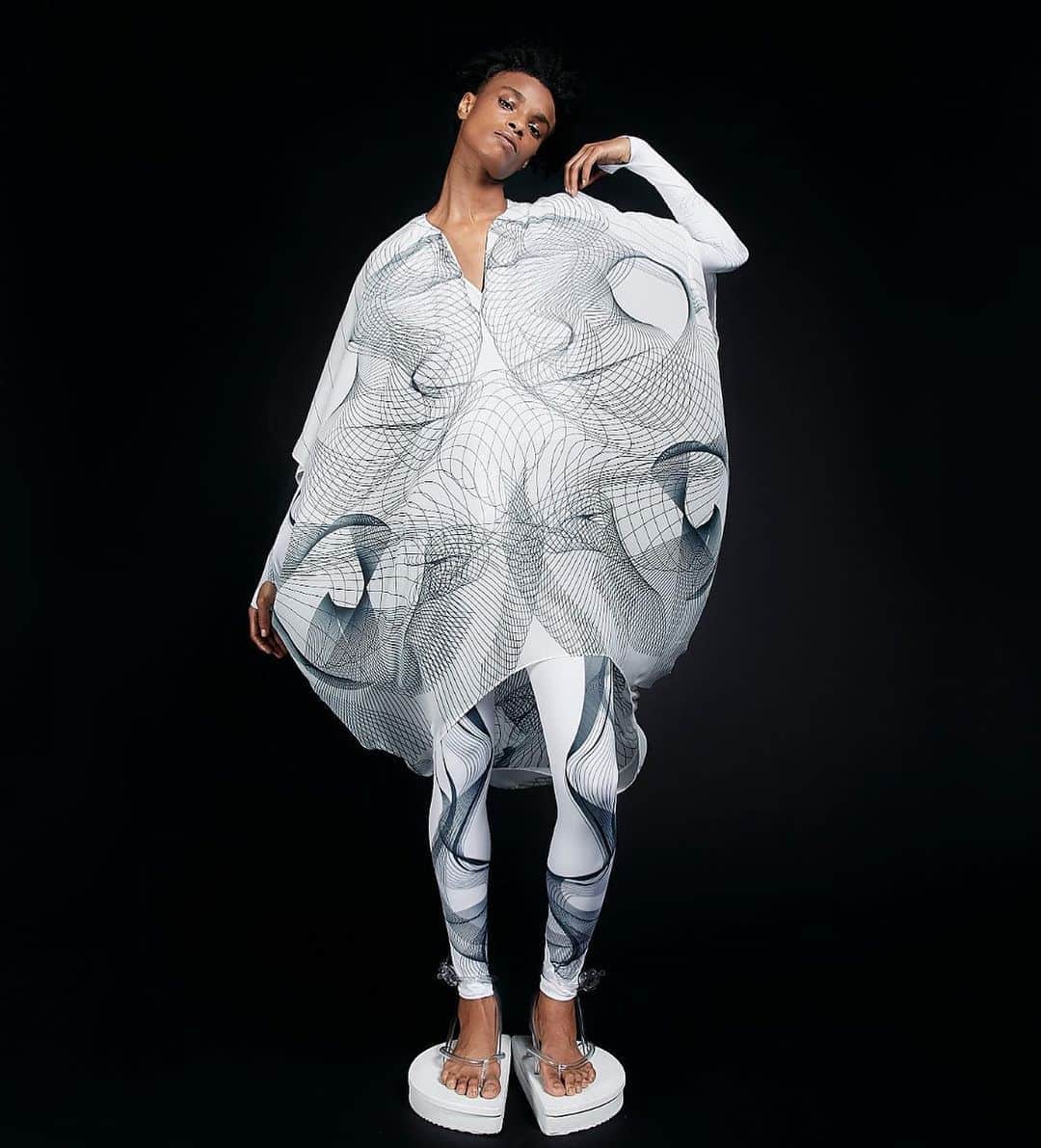 スリーアズフォーのインスタグラム：「Our New collection “Vesica Piscis” is out on @voguerunway  Photographer : Elisabet Davids @elisabet_davidsdottir @elisabetd  Model: @complete_clarity at Ford Models  @fordmodels  Stylist : Victoria Bartlett @victoria_bartlett_nyc  Hair: Kenta Koda @kenta.koda  Makeup: Chichi Saito @chichisaito  Prints in collaboration with Mimaki  @mimakiusa @mimakiusa_textile  @threeasfour #threeasfour #vesicapiscis」