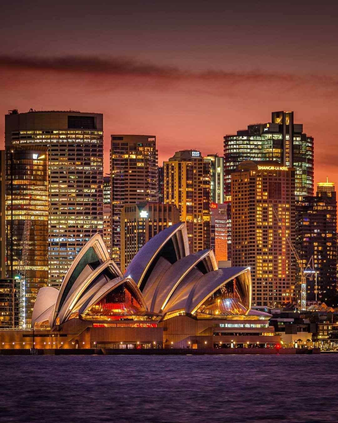 Australiaさんのインスタグラム写真 - (AustraliaInstagram)「Don’t mind us, we’re just mesmerised but another glorious @Sydney sunset 🔥 @janbreckwoldt_photography captured this shot of the #iconic @sydneyoperahouse as the sun sets over the @visitnsw harbour. There is also something a little extra special about this photo – can you spot it? In the windows of the harbourside hotel @shangrilasydney is a message of love 🧡 One of the best ways to see this #instaworthy view is by hopping on a ferry at #CircularQuay, or for the more adventurous, enjoy panoramic harbour views from the top of the #SydneyHarbourBridge with a @bridgeclimb. #seeaustralia #newsouthwales #ilovesydney #shangrilasydney #bridgeclimb #holidayherethisyear」10月16日 19時00分 - australia