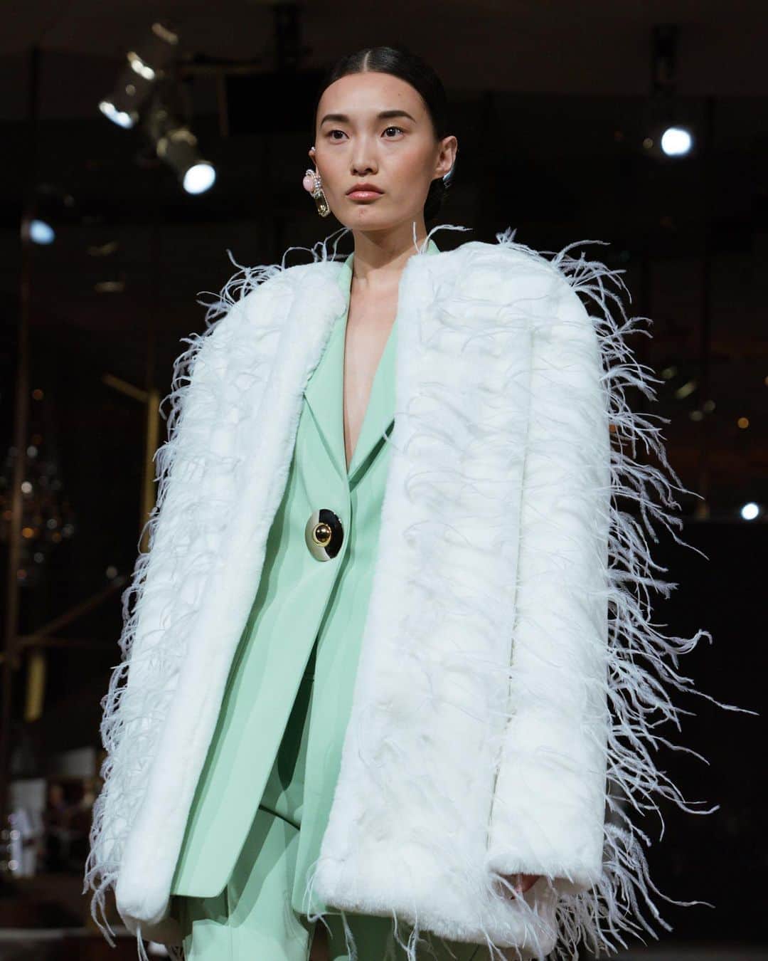 のインスタグラム：「Hand tailored suiting with an elegant topper.  Ivory faux fur coat with hand embroidered ostrich feathers and a hand tailored sage crepe suit from the Fall 2020 collection.」