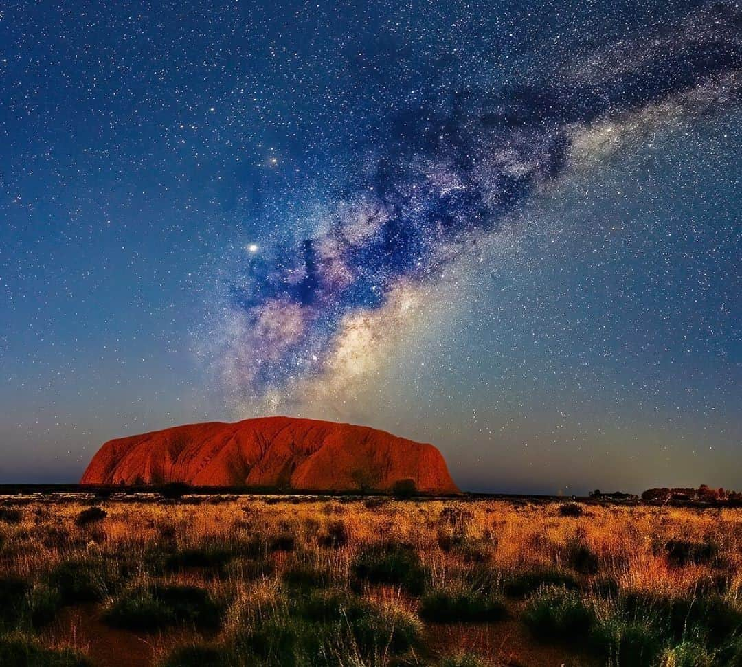 Australiaさんのインスタグラム写真 - (AustraliaInstagram)「Did you know, the @ntaustralia is one of the best places to see the #MilkyWay?🌟 @insiteimage captured this dazzling sky show as the sun went down in @seeuluru recently, concluding that “Australia's #Uluru is at the Galactic Center of the universe”! @visitcentralaus boasts some of the clearest skies for #stargazing in the country, so when planning your next visit, be sure to book a few nights at the @exploreuluru resort and join a cultural stargazing tour before dining out in style under the stars at the famous #SoundsofSilence alfresco buffet. #seeaustralia #ntaustralia #redcentre #uluru #holidayherethisyear」10月17日 19時00分 - australia