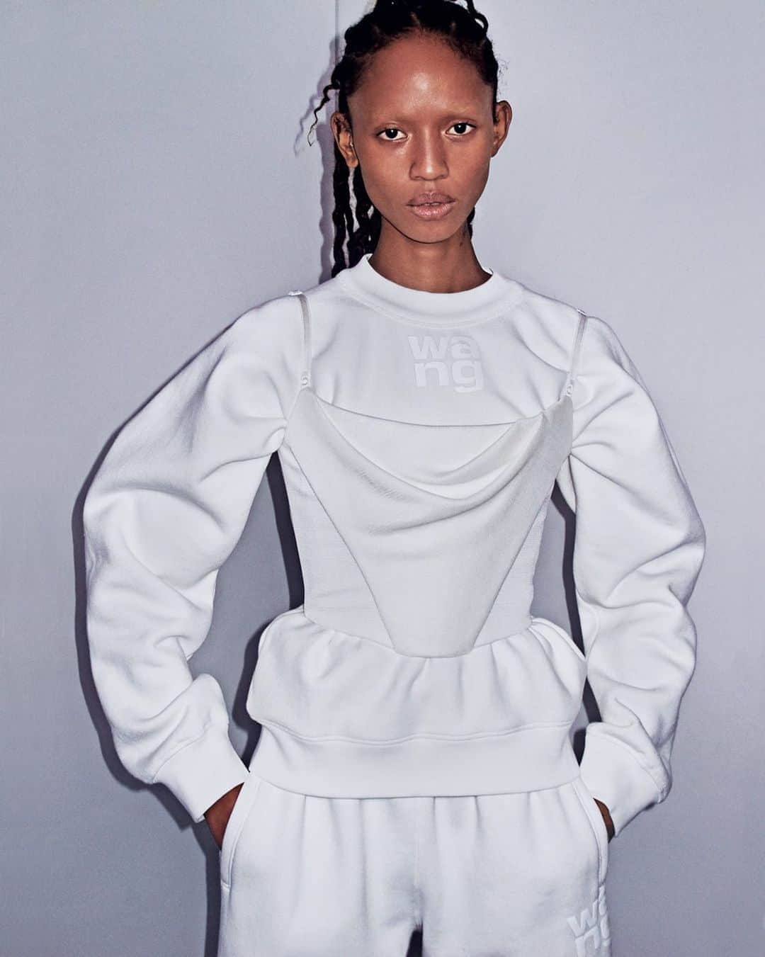 アレキサンダー・ワンのインスタグラム：「Soft serve. Sharp focus. -  HEAVY TERRY FOUNDATION CREWNECK SWEATSHIRT WITH PUFF PAINT LOGO.  CAMI TOP WITH INTERIOR CORSET AND DRAPING DETAIL AT BUST.  HEAVY BRUSHED FOUNDATION SWEATPANTS WITH PUFF PAINT LOGO ON LEFT UPPER THIGH.  SOFT SERVE SHOT TO SHOP BY STEVEN KLEIN. #alexanderwang」