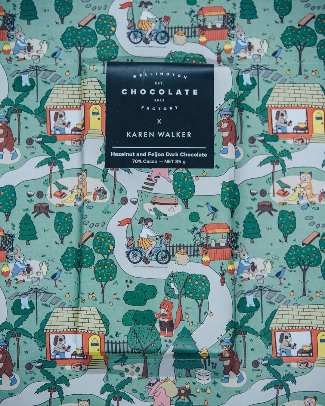カレンウォーカーのインスタグラム：「Our debut ready-to-eat collection is crafted by New Zealand's original bean-to-bar chocolate-maker, @WellingtonChocolateFactory. Handmade in Wellington, this collection uses the highest quality beans from ethical suppliers that support local farmers and ensure fair trade. A nostalgic journey through NZ backyard flavours, there are three bespoke bars; Hazelnut and Feijoa Dark Chocolate, Blood Orange Dark Chocolate and Coconut and Passionfruit Milk Chocolate, all made in a Runaway Girl mould and wrapped in our ‘Backyard’ print.      As you unwrap your bar, look out for a special golden ticket from Karen as you could be one of two lucky people who’ll find a 9 carat gold Mini Runaway Girl Necklace.    Available from karenwalker.com*, KW stores and Wellington Chocolate Factory now! *This chocolate can only be shipped within New Zealand at this time.」