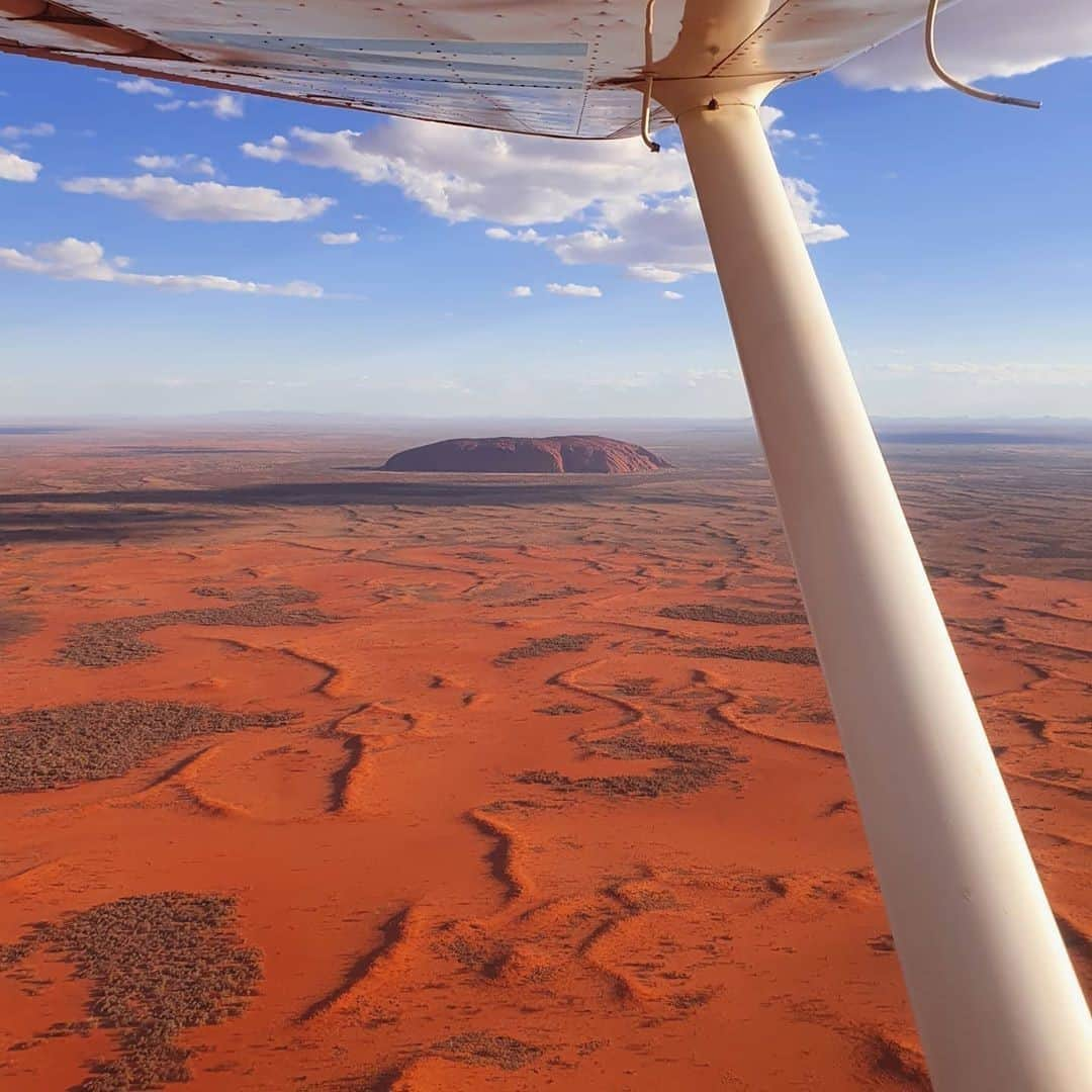 Australiaさんのインスタグラム写真 - (AustraliaInstagram)「Just another day in the office, eh? ✈️ After seeing this epic @seeuluru shot by pilot @elwingstar, we think she might just have one of the best jobs in the world 😍 Located in @ntaustralia’s iconic #RedCentre, #UluruKataTjutaNationalPark is a significantly spiritual destination where the traditional owners, the Anangu people, have a deep and special connection with the land. You can learn about their stories and culture whilst exploring the magnificent rock formations of @visitcentralaus with @exploreuluru, or book an @ayersrockscenicflights tour to experience it from a completely different perspective. #seeaustralia #ntaustralia #redcentreNT #holidayherethisyear」10月19日 19時00分 - australia