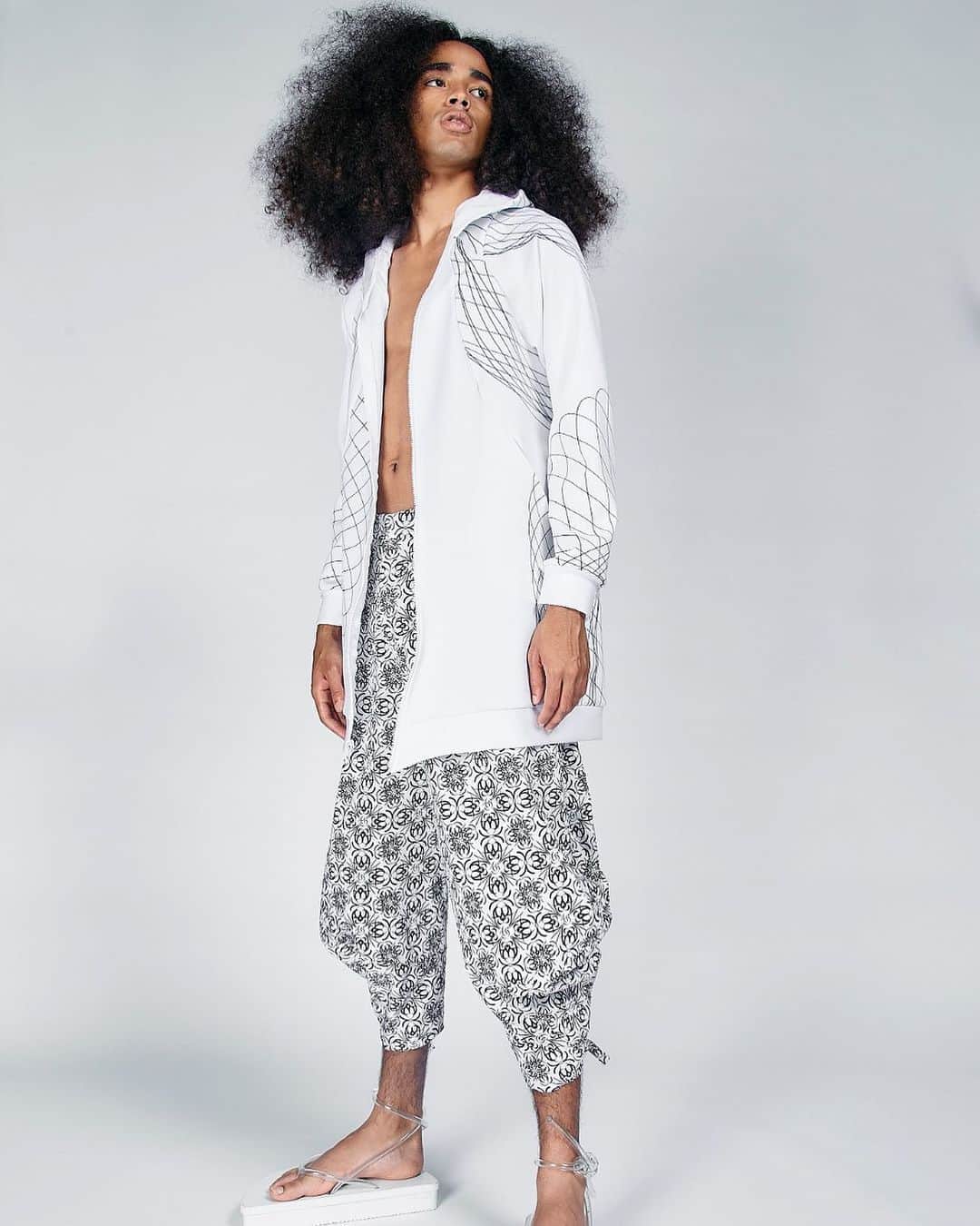 スリーアズフォーのインスタグラム：「Our New collection “Vesica Piscis” is out on @voguerunway  Photographer : Elisabet Davids @elisabet_davidsdottir @elisabetd  Model: Joseph Gelpi @chicojoseph at Ford Models  @fordmodels  Stylist : Victoria Bartlett @victoria_bartlett_nyc  Hair: Kenta Koda @kenta.koda  Makeup: Chichi Saito @chichisaito  Prints in collaboration with Mimaki  @mimakiusa @mimakiusa_textile @threeasfour #threeasfour #vesicapiscis」