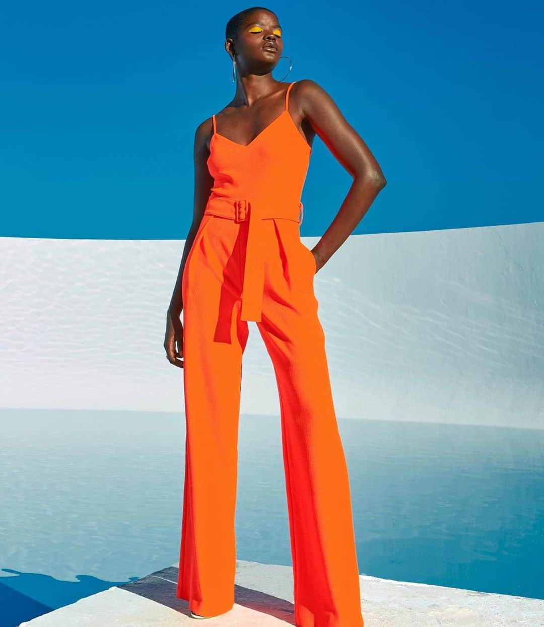 のインスタグラム：「Who else feels so bold when wearing Orange? 🧡// Jumpsuit: Evie Jumpsuit // #BlackHalo」
