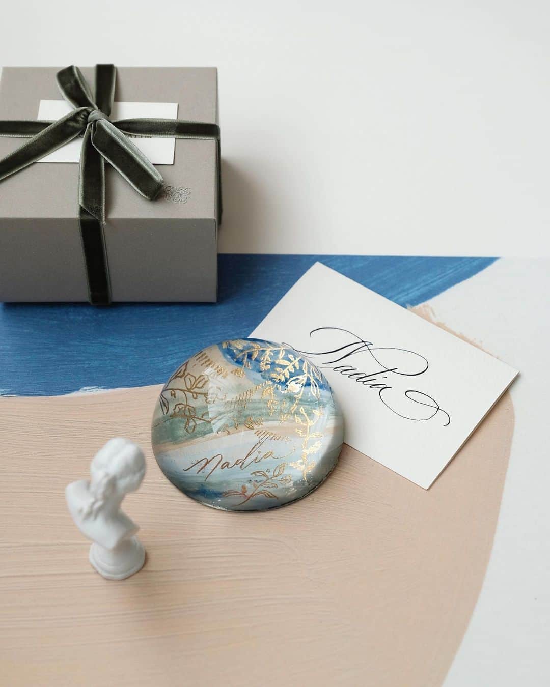 のインスタグラム：「The lake side view — Reminiscing the beautiful colors of Lake Wanaka. Personalized for @nadsap @alexandergotama — #truffypi #paperweight #domeproject #glasspaperweight #personalizedgift #handpainted #painting #madetoorder #mixmedia  #calligraphystyling #tabletop #stationery #カリグラフィースタイリング  #artobject #waterdrop #bespokestationery #bespokegift #personalizedgift #monogram #calligraphylifestyle #artisanmade」