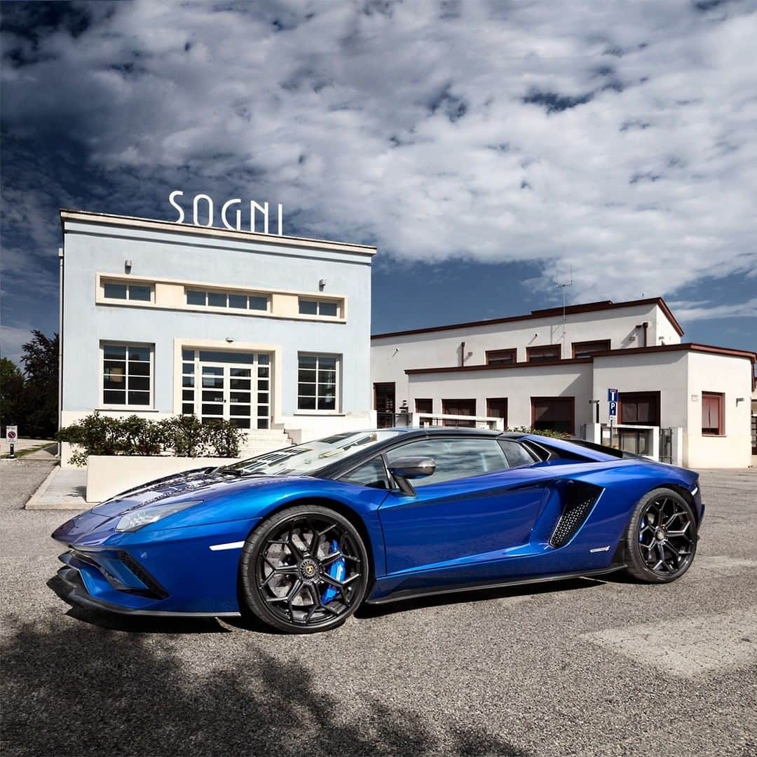 ランボルギーニのインスタグラム：「The diversity of Emilia Romagna, the home of Lamborghini, fosters creativity and harmony. Aventador S Roadster and @pierogemelli explore the hidden gems of this stunning Italian region, taking this Super Sports Car off the main road and into calm where the silence amplifies its roar.  #Lamborghini #AventadorSRoadster #WithItalyForItaly #EmiliaRomagna」