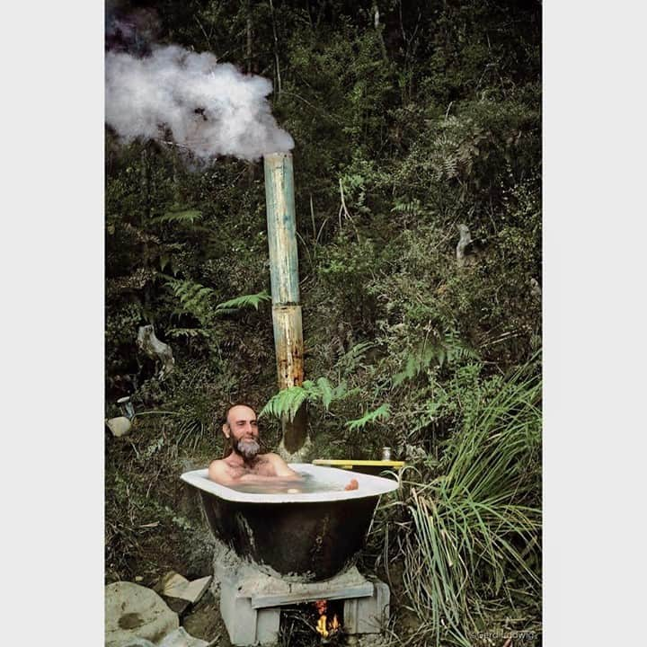 Gerd Ludwigのインスタグラム：「Acclaimed Austrian artist Friedensreich Hundertwasser takes a bath in his makeshift tub in the native forest of New Zealand.   I donated this print to be auctioned off as part of the Los Angeles Center of Photography’s annual virtual benefit gala, this year celebrating my dear friends and legends in photography, Douglas and Françoise Kirkland. To see more of the images for auction, go to the link in @la_centerofphoto’s bio.  As a young photographer in 1978, I spent a few weeks with world-renowned eccentric artist, architect and early environmentalist Friedensreich Hundertwasser at his expansive, rugged property in the Bay of Islands in New Zealand. In his art and architecture, he used bright colors and organic forms, was fascinated by spirals and considered straight lines as “immoral and godless.”  @thephotosociety @douglaskirkland_ @coise43 #Hundertwasser #BayofIslands #NewZealand」