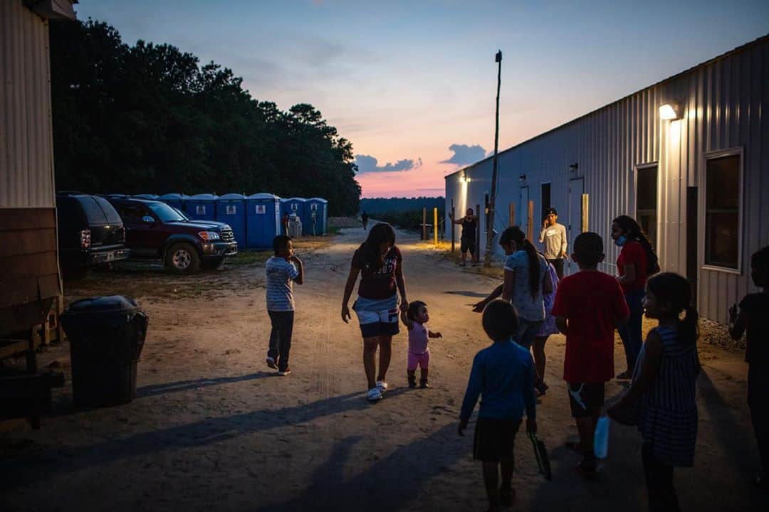 ナショナルジオグラフィックさんのインスタグラム写真 - (ナショナルジオグラフィックInstagram)「Photos by @katieorlinsky / Children at a farmworkers' camp in Atlantic County, New Jersey. The hundreds of thousands of temporary agricultural workers who arrive in the U.S. each year often bring their children with them. One of the most surprising things I found while documenting blueberry farm workers in New Jersey this summer was that it is legal for minors over the age of 12 to work on farms, as long as it is not during school hours and they have written parental consent (or it's a farm where a parent is employed.) Typically farmworkers’ children can attend government-sponsored programs that provide free meals and education, and they also offer night classes tailored to the unique schedules of children who work. These programs were cancelled this year because of the pandemic. Parents can’t afford to stop working in the field, and many cannot afford childcare, so this summer many of the younger children ended up staying at the migrant camp for up to 15 hours a day, with only an older sibling or a grandparent to look after them.   Check out @natgeo’s link in bio for more on this story, created with the support of the @insidenatgeo COVID-19 Emergency Fund.」10月22日 23時45分 - natgeo