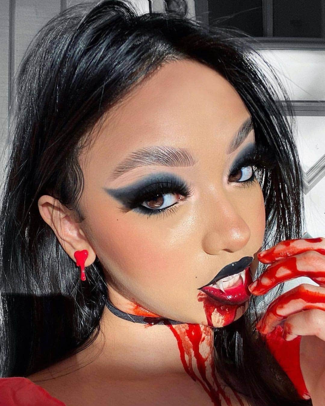 NYX Cosmeticsさんのインスタグラム写真 - (NYX CosmeticsInstagram)「When you're hangry 🧛‍♀️🩸@aafrrin transforms herself into this glam vamp using: 🖤 Ultimate Shadow Palette in 'Phoenix' 🖤 Epic Wear Liner Stick in 'Pitch Black' 🖤 Micro Brow Pencil 🖤 Wonder Stick in 'Deep' 🖤 Butter Gloss in 'Red Velvet' 🖤 Matte Setting Spray  • #nyxcosmetics #nyxprofessionalmakeup #crueltyfreebeauty」10月24日 7時28分 - nyxcosmetics