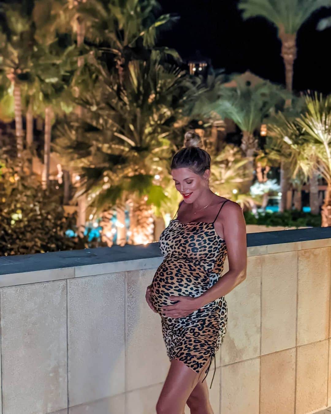 Ashley Jamesさんのインスタグラム写真 - (Ashley JamesInstagram)「Do you feel like you can still dress sexy whilst pregnant, or do you worry it's not appropriate? 🐯 Last night I'd already done my makeup, and went to put on this dress and then thought: "maybe it's too much to wear leopard print and a red lip whilst pregnant?  Then I had to stop myself, and think how ridiculous that sounded. I'm still me, I still get to dress in a way that makes me feel the most confident... And if anything I feel more sexy now than I ever have. Surprisingly, a lot of you replied to my stories saying that you loved your body the most when you were pregnant. I don't know what it is, because me too...  Then interestingly today I listened to a TED Talk all around sexuality and pregnancy / motherhood that was fascinating.  She talked about how women (and girls) are objectified so much in society, and this is perpetuated by the media.  We make the assumption that any woman showing cleavage is trying to be seductive, and we see underage girls being sent home from school because their outfits are a distraction to boys and teachers. But we remove pregnant women and mother's from this sexualisation, yet we still objectify them.  When women become pregnant they leave the realm of male sexual desire and fall into their reproductive role. This is why even near strangers touch their bumps, and ask intimate details  such as if it was planned or your birth plan (and then explain why it's wrong when you tell them).  It's the sexualisation of women that has created an normal attitude towards breasts. They are made for breastfeeding, yet people are so embarrassed, or feel so much shame that they feed in a toilet. that's just the talk in a nutshell but it was so interesting. It got me thinking that maybe I felt like I shouldn't dress sexy, because before I was pregnant I too viewed pregnant women from their sexuality? I'm definitely noticing a lot of internalised misogyny in pregnancy. Anyway, I'm not sure if these ramblings make sense, but just what's on my mind today... Would love to know your thoughts. The dress is an old one from my clothing collection with @littlemistressuk - I made it for big boobed dressing, but turns out it's perfect for a bump too. 🐯💞」10月25日 3時10分 - ashleylouisejames
