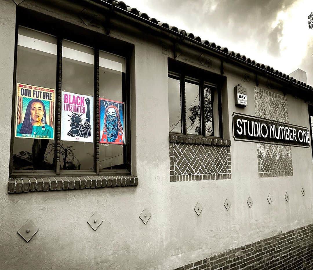 Shepard Faireyのインスタグラム：「I'm proud to display the latest cover I designed for @time alongside posters from Artist and former co-worker @ernestoyerena and #SNO's Senior Graphic Designer @nevermade on our studio building in Los Angeles. #ElectionDay is only 9 days away... let's get out the #VOTE!  #studionumberone @subliminalprojects #losangeles #obeygiant #nevermade #ernestoyerena #shepardfairey #time #echopark Photo: @vikkila」