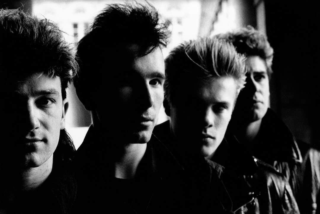 U2さんのインスタグラム写真 - (U2Instagram)「A quick shoot in Paris 1983 around the 'two hearts beat as one' video shoot. Slightly classical line up but worked very well due to the side light as we shot under the arches at le Jardin du Palais Royal. I recall that, as we were so rushed, I had parked my car quickly but such that no car could go thru the street, so when I got back to it there were a lot of infuriated Parisians so I had to quickly jump into my car before they realised I was that driver and escape the scene. #AntonU2Takeover @antoncorbijn4real」11月24日 22時59分 - u2