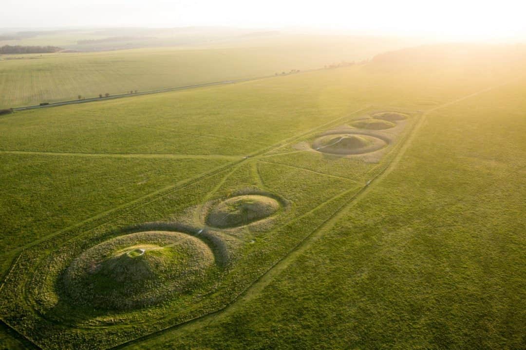 National Geographic Travelさんのインスタグラム写真 - (National Geographic TravelInstagram)「Photo by George Steinmetz @geosteinmetz / Graves of the ancients are aligned with the setting sun near Stonehenge, England. These bowl-shaped mounds typically mark the burial place of a single important or wealthy individual from the Bronze Age some 4,000 years ago. These mounds, known as the Normanton Down barrow group, are located within sight of Stonehenge. They are among hundreds of other earthen monuments and ancient cemeteries that ring the famous standing stones over several miles of countryside. Such places make me wonder what we will leave behind when we are the ancients and how our age will be perceived thousands of years from now.  To view more of our world from above, follow @geosteinmetz.」11月21日 16時39分 - natgeotravel