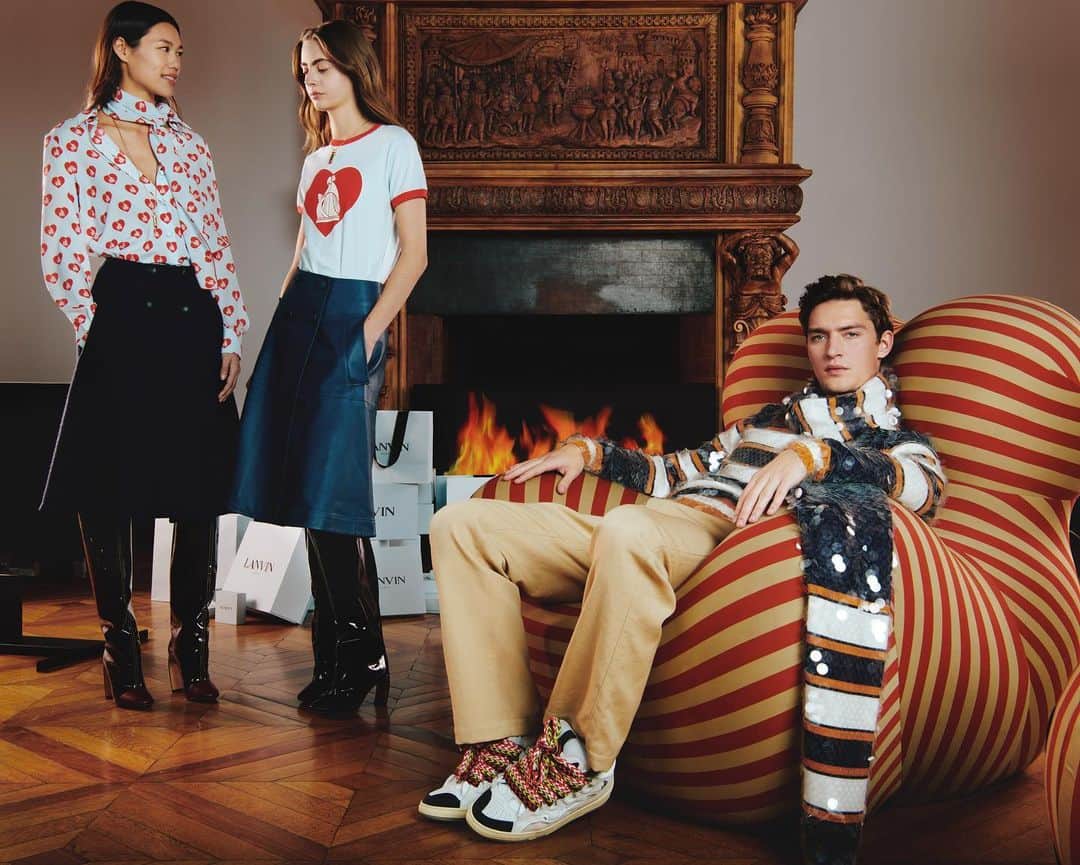 ランバンのインスタグラム：「Holiday season outfits : « Mother and Child » prints, skirts and J Heel boots for her - matching striped sweater & scarf with sequins, trousers and Curb sneakers for him #LanvinFW20」