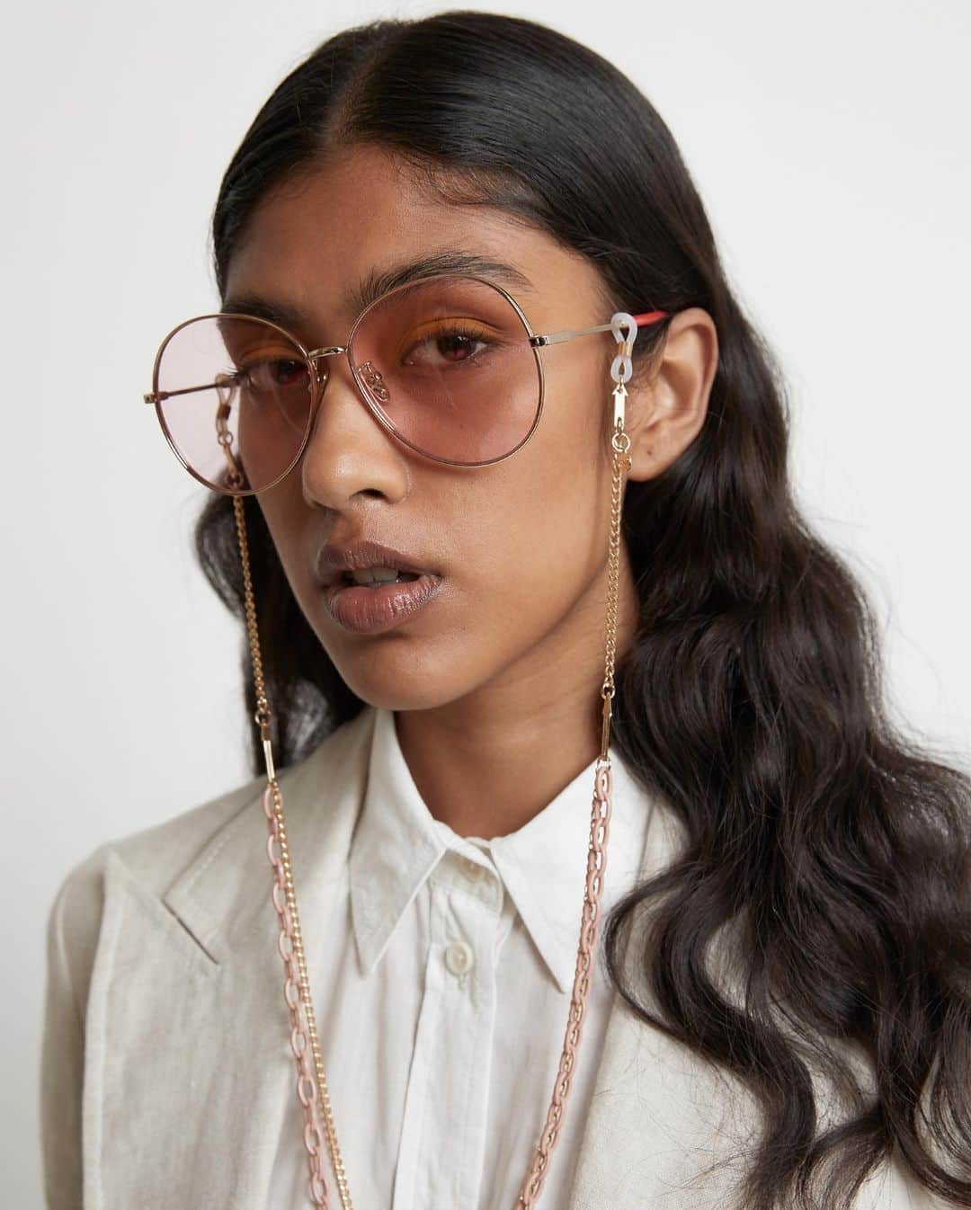 カレンウォーカーのインスタグラム：「Syrupy pink tint lenses are rimmed by gold metal frames for our new style, ‘Afterglow’, paired with the KW Arrow Combo Chain」