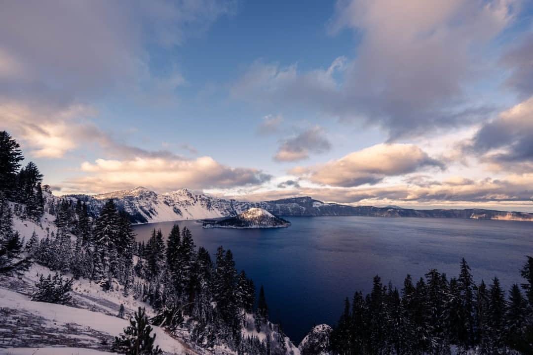 National Geographic Travelさんのインスタグラム写真 - (National Geographic TravelInstagram)「Photo by @taylorglenn / Crater Lake in Oregon is seen after the first significant snowfall of the season. This magnificent body of water was formed over centuries as rain and snow filled the caldera of the former Mount Mazama, which erupted some 7,700 years ago. Follow @taylorglenn for more from our national parks. #craterlakenationalpark #oregon」11月23日 20時39分 - natgeotravel