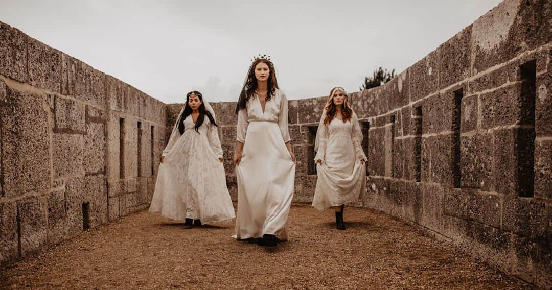 ミナのインスタグラム：「Have you carved the pumpkins yet? We've uploaded some witchy wedding inspiration to our website for all you alternative brides out there. Even if you're not planning an alternative wedding with witchy vibes, take a look as Halloween is an excellent excuse to wear your wedding dress again after your wedding! Happy Halloween everyone! Link in bio.⁠ ⁠ To read more about the styling of the shoot, visit @the_un_wedding blog.⁠ ⁠ Concept & Hair and Makeup: @hollieadanby_makeup ⁠ Concept & Photography: @Sarah.mac.photography ⁠ Planner & Stylist: @wildwoodweddingsandevents ⁠ Venue: @nothe_fort ⁠ Models: @kjhmodelling @aiichamarie_ @Leah_jxck ⁠ Flowers: @robynsnestfloraldesign ⁠ Props: @rokabellaroseweddings ⁠ Stationery: @scribe.stationery ⁠ Tableware: @fabulouscompany ⁠ Ceramics: @imogen_charleston_ceramics ⁠ Accessories: @victorialouiseaccessories ⁠ Veils: @w_collective ⁠ Table and Benches: @ jaquesandco⁠ ⁠ ⁠」