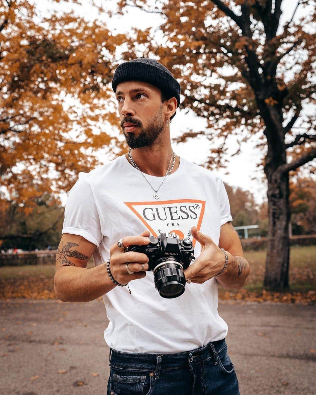 ゲスのインスタグラム：「in the moment 📸🍂 @princeofjetset in the Classic Logo Tee from our eco-conscious #SmartGUESS collection」