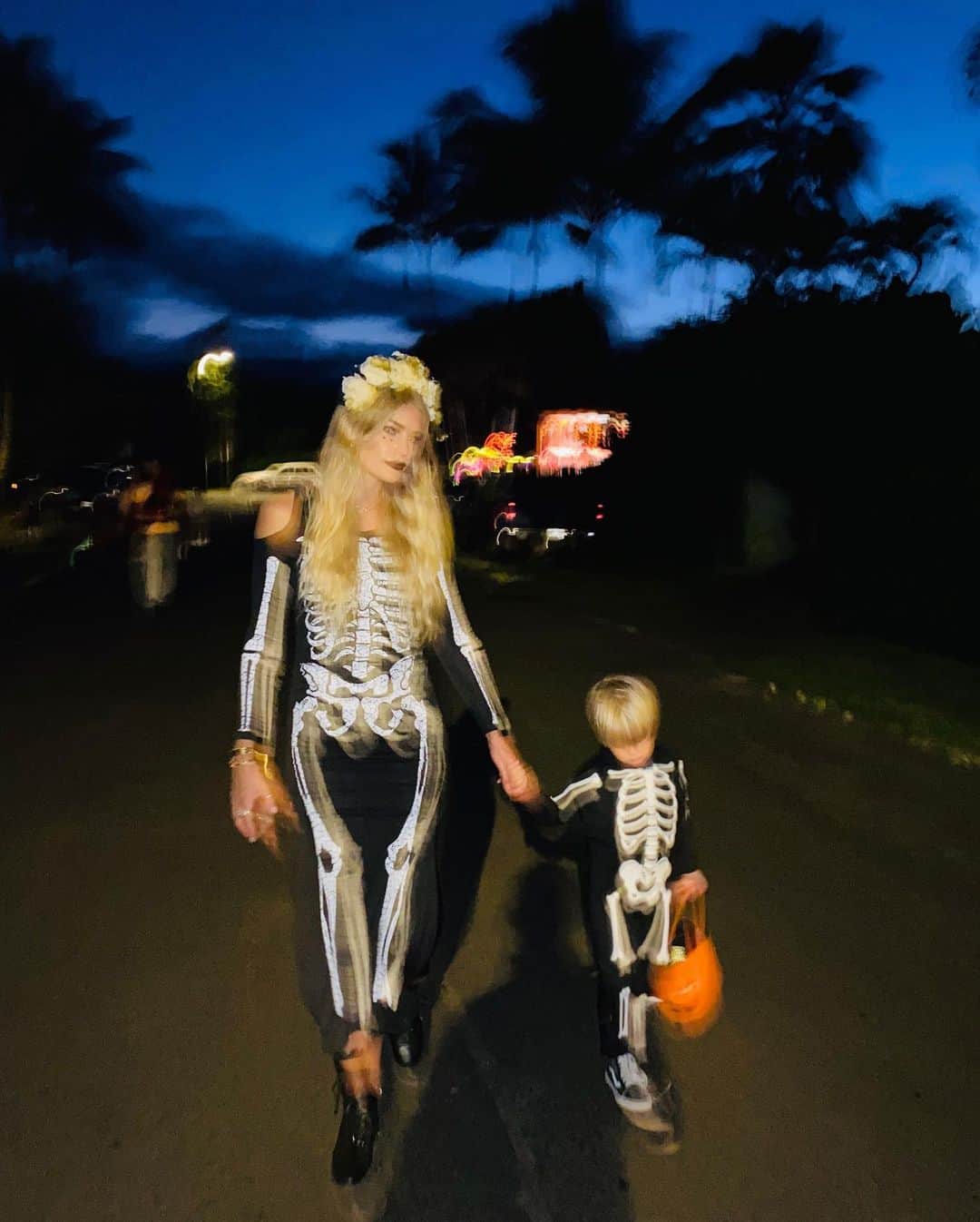 トリ・プラバーのインスタグラム：「In case you need a quick break from election coverage... the cutest skeleton and I on Halloween 💀🖤」