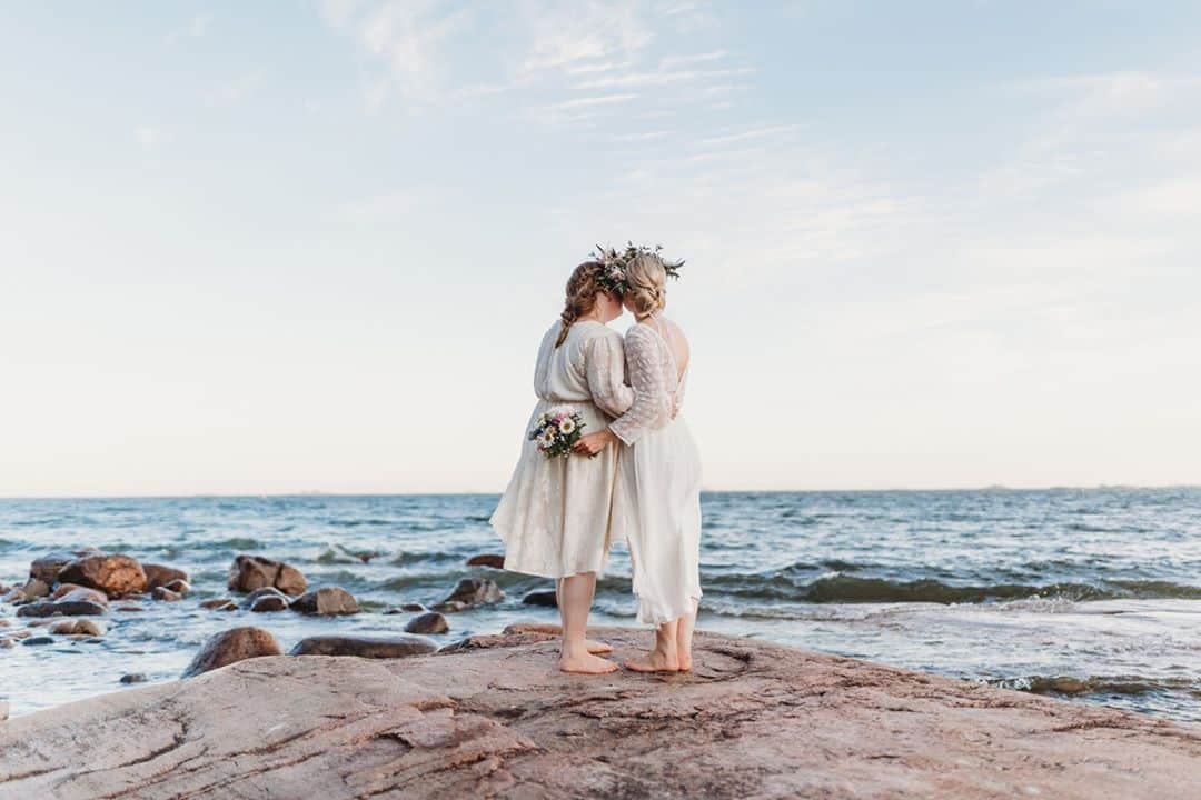 ミナのインスタグラム：「Same sex couples sometimes struggle to find dresses that are different from each other but share the vibe of the wedding. Veera and Iida got married in Finland and chose our Lucinda and Brie dresses without trying them on! They were super happy with their dresses and had small alterations done to ensure the perfect fit. The dresses complement each other and are perfect together. 😍⁠ ⁠ Photography: @lottapolviander⁠ ⁠ ⁠ ⁠」