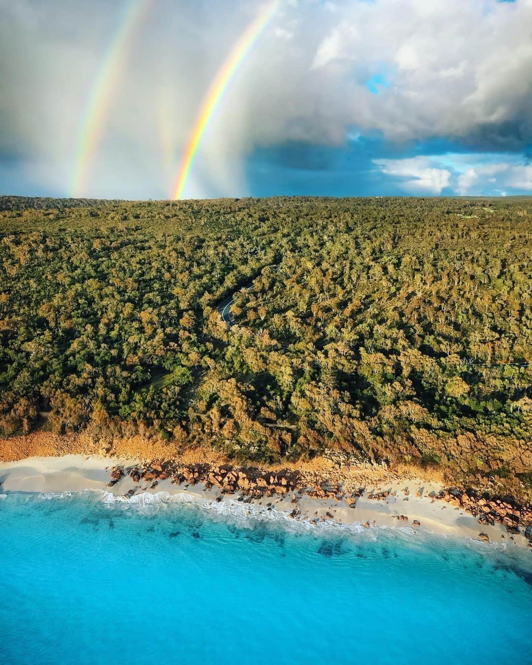 Australiaさんのインスタグラム写真 - (AustraliaInstagram)「Looks like good luck is coming our way! 🌈🌈 @tomproudfoot saw these twinning rainbows over the beautiful #MeelupBeach in @margaretriver. The protected bay here is perfect for swimming and snorkelling and is surrounded by beautiful coastal walking trails and quiet, shady picnic spots. It’s also one of the few places in @westernaustralia where you can watch the moon rise over the ocean! Meelup is just a ten-minute drive from #Dunsborough and we can't help but recommend a lunch trip to @dunsboroughbakery, @simmosicecreamery or one of the many local wineries. #seeaustralia #thisisWA #holidayherethisyear」11月4日 19時00分 - australia