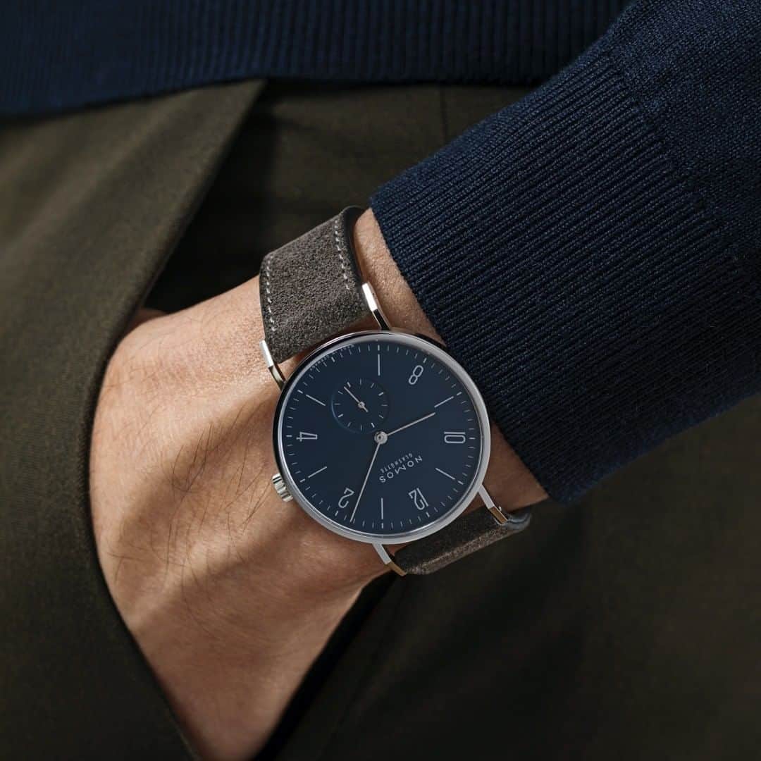 のインスタグラム：「The evenings are drawing in, and we're starting to feel a little festive—every time the light catches the silver accents on Tangente 38 midnight blue. An elegant contrast: the dark velour leather strap.  #nomostangente #tangente #nomos #nomosglashuette #watch #watchoftheday #watchgeek #madeingermany #wristwatch #wotd #finewatches」