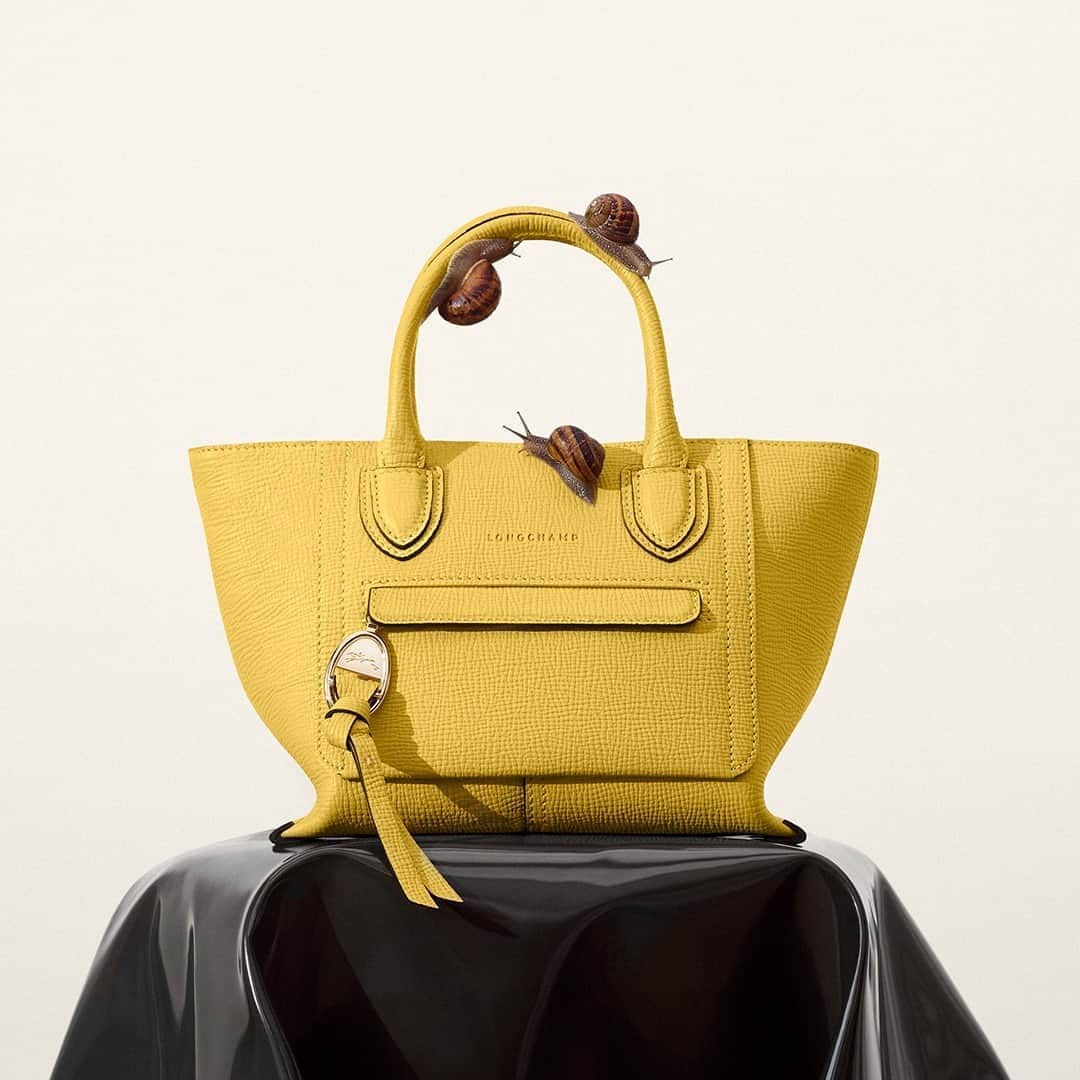 Longchampのインスタグラム：「“The color!” said the first snail. “The shape!” said the second. “The texture!” said the third. “Très chic… très très chic.”   #LongchampMailbox  #LongchampFW20  #Longchamp」