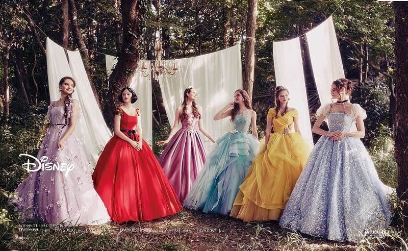 St.AQUA 東京の結婚式場 サンアクアチャペルのインスタグラム：「ディズニー ウエディングドレスコレクション 待望の第5弾。 ディズニーを代表するプリンセス＆キャラクター をテーマにしたオシャレ大人女子必見のドレス。  ●DWS0059　purple ●DWS0050　red ●DWS0054　pink ●DWS0055　bluegreen ●DWS0057　yellow ●DWS0052　blue   #disney #disneyprincess #disney_weddingdresscollection #wedding #weddingdress #dress #bridal #whitedress #ディズニー#ディズニー_ウエディグ ドレスコレクション  #ディズニープリンセス #プリンセス #ウエディングドレス #結婚式  #結婚 #プレ花嫁 #卒花嫁  #花嫁 #カラードレス #クラウディア #kuraudia    ディズニーオフィシャルホテルへの持ち込みは ご遠慮いただいております。 ©Disney」