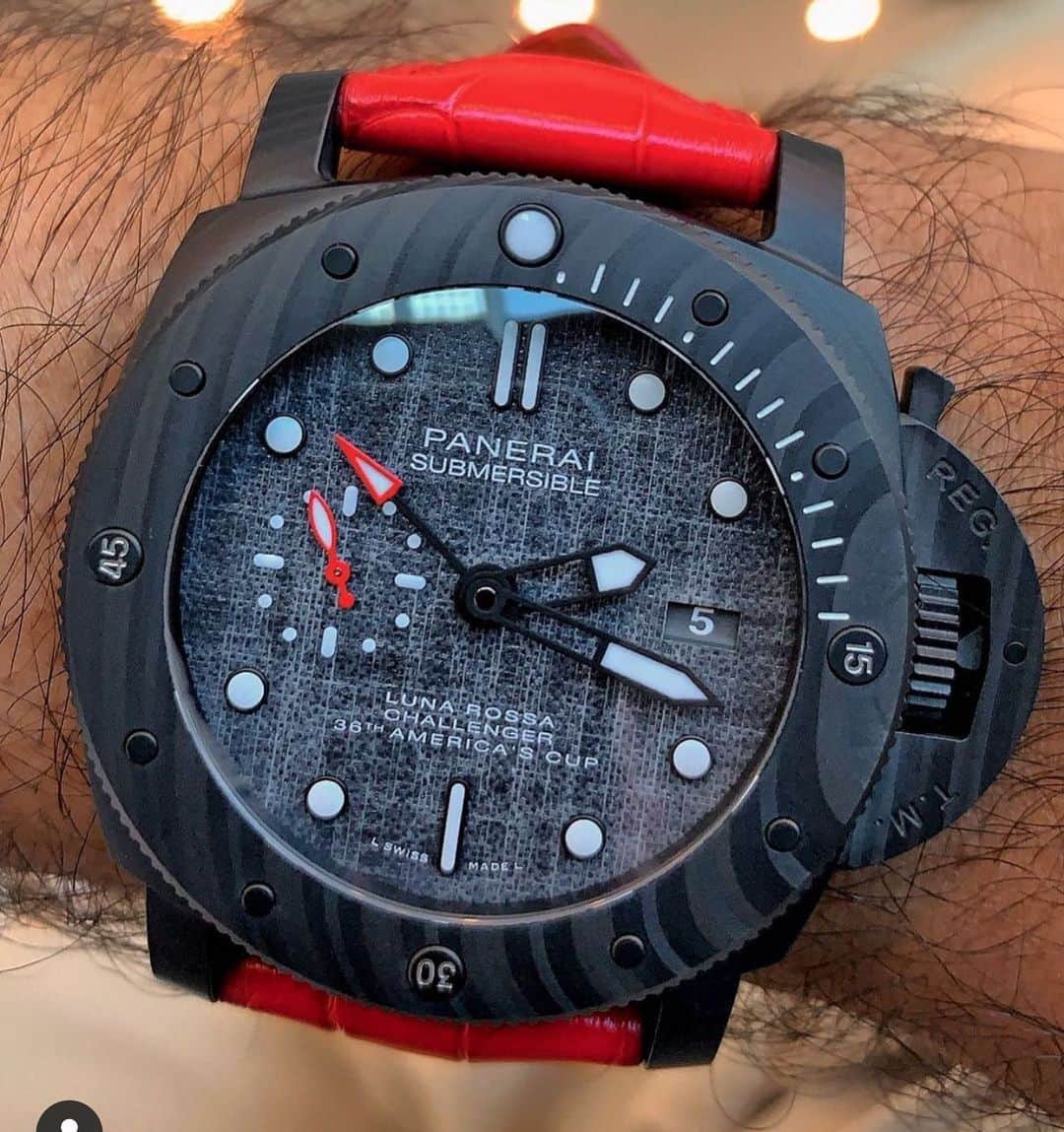パネライのインスタグラム：「Black and red is probably one of my favorite combinations when it comes to a lot of things. It’s no different with the #Panerai #PAM1039 Luna Rossa Submersible.   Featuring a 47mm Carbotech case, a dial made from fabric from the Luna Rossa racing yacht, and red accents on the hands. All topped off woth that red strap. What do you think of it?  Pic by buddy @mabulqassem #paneraicentral」