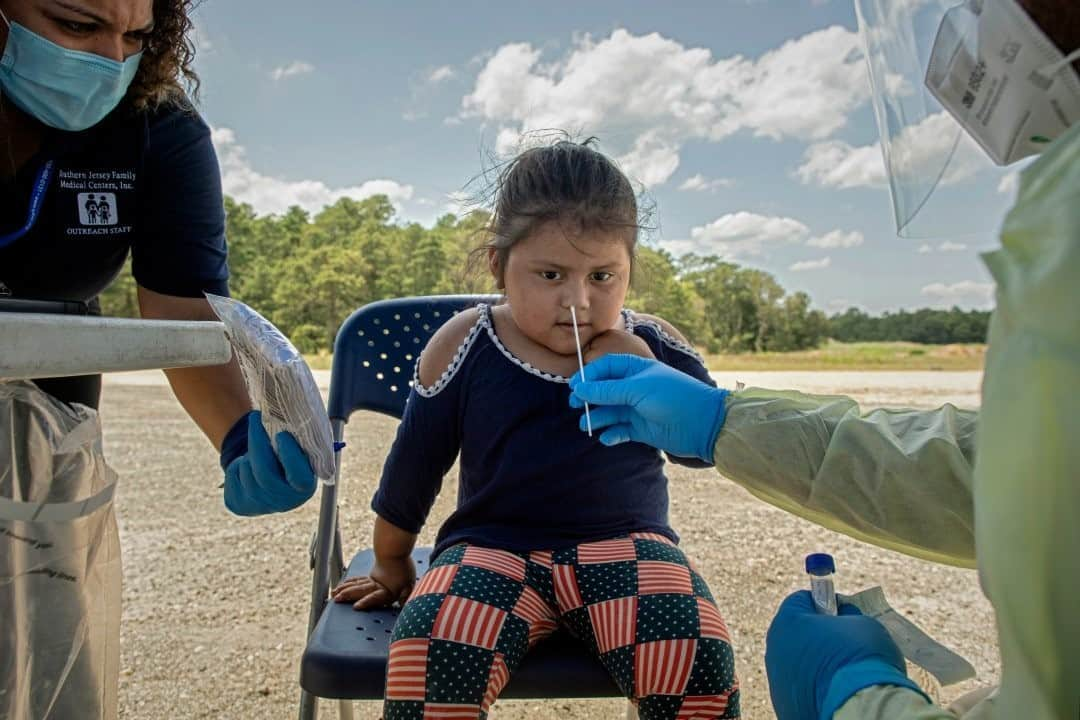 ナショナルジオグラフィックさんのインスタグラム写真 - (ナショナルジオグラフィックInstagram)「Photo by @katieorlinsky / At a blueberry farm in May’s Landing, New Jersey, farmworkers and their children are tested for COVID-19 at a pop-up run by the Southern Jersey Family Medical Centers, an organization that has done most of the testing at area blueberry farms. Every year an estimated 6,000 migrant farmworkers arrive at blueberry farms in South Jersey for the short and intense eight-week summer harvest. Workers often bring their children with them and normally these children can attend all-day, government-sponsored programs that provide free busing, three meals, academic instruction, summer camp, and English classes. This year, programs were cancelled because of the pandemic. Check out @natgeo’s link in bio for more on this story, created with the support of the @insidenatgeo COVID-19 Emergency Fund.」11月6日 20時39分 - natgeo