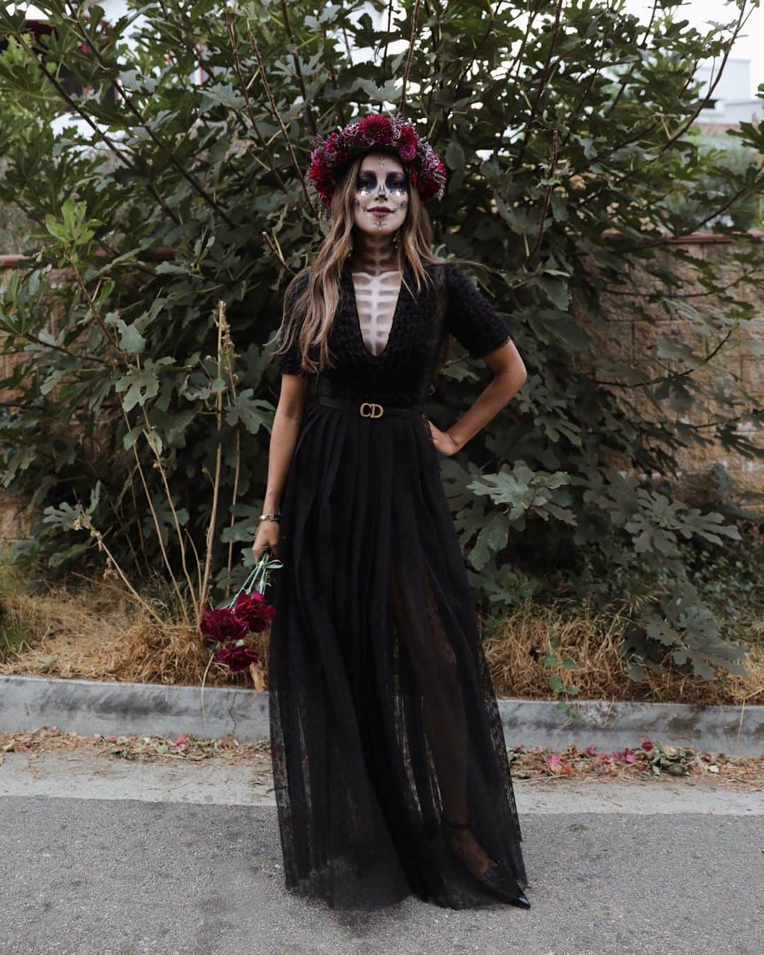 ジュリー・サリニャーナのインスタグラム：「Last one, I promise, to wrap up my 2020 #dayofthedead look! This year was extra special so thank you @dior for dressing me & my sister @lilylove213 for the makeup, floral wreath by me! ✨🕊🖤  See you next year with my #ddlm look 💀 Ps. Thank you guys sooo much for all the sweet comments!! Love you!!」