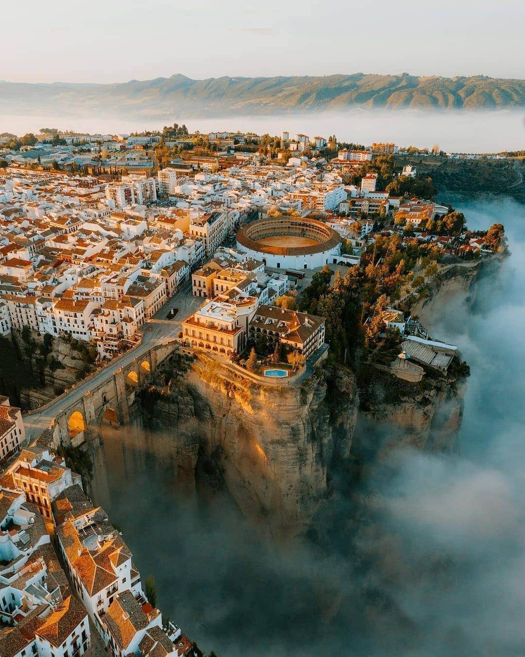 BEAUTIFUL DESTINATIONSさんのインスタグラム写真 - (BEAUTIFUL DESTINATIONSInstagram)「Dramatic perspectives over the ancient city of Ronda ✨ Which photo speaks out to you the most: 1, 2, 3 or 4? ⛅️  "This morning was one where everything came together. A mountain storm from the night before had settled and rain condensed to form a misty inversion. We watched fog swirl and then vanish as it hit the cliff edge, light rays filtering through The Puente Nuevo bridge as the sun rose."  📸 Photo and Story by @jamesrelfdyer  📍 Málaga, Spain」11月7日 18時06分 - beautifuldestinations
