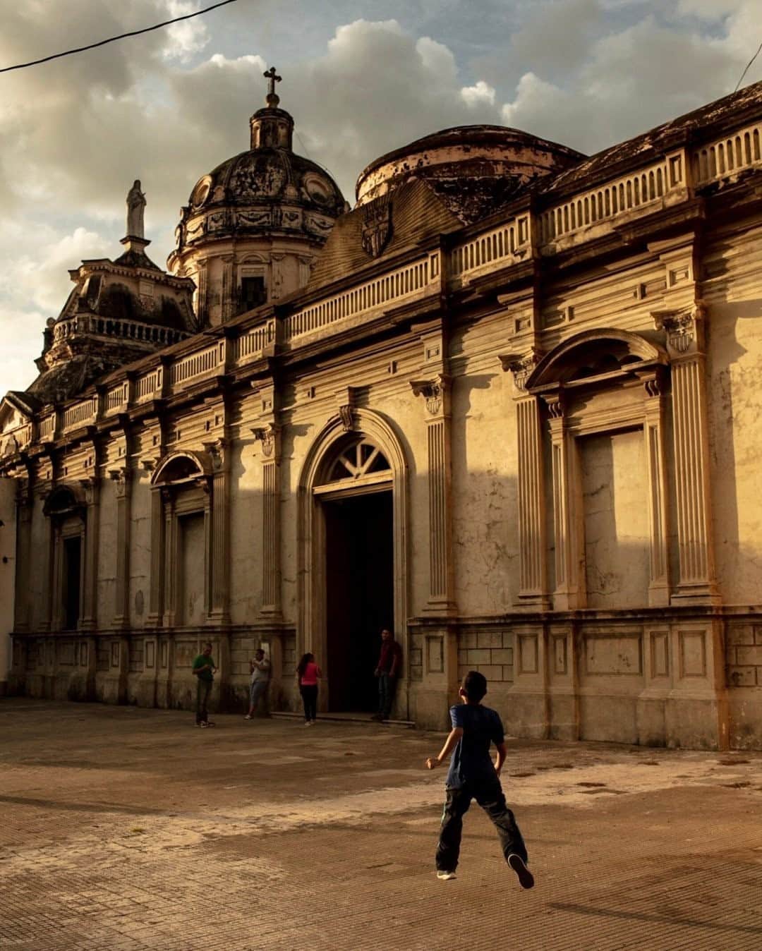 National Geographic Travelさんのインスタグラム写真 - (National Geographic TravelInstagram)「Photo by @joshuacogan / A boy runs outside Iglesia la Merced in Granada, Nicaragua, during the last light of the day. The church, originally built in 1534 and then rebuilt in 1670, has a rich history. Every evening folks gather around its plazas, some to play and some to pray. To see more images of Nicaragua and throughout the world, follow me @joshuacogan. #nicaragua」11月8日 20時38分 - natgeotravel
