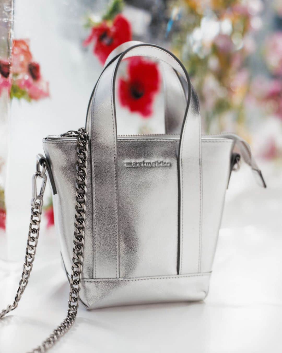 マリメッコのインスタグラム：「COMING SOON! A bag full of sparkle: introducing our new silver Nano Matkuri with a metal chain. Head over to marimekko.com to get notified when the Nano Matkuri bag is available. #marimekko」