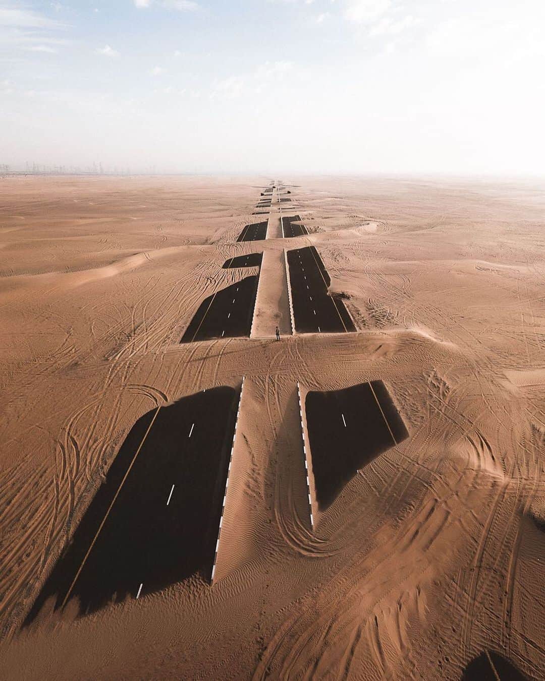 Instagramさんのインスタグラム写真 - (InstagramInstagram)「#HelloFrom the outskirts of Dubai. ⁣ ⁣ We are dreaming of this surreal, abandoned location where shamal desert winds blow bright golden sands across the asphalt roads. ⁣ ⁣ Photo by @kylevollaers」11月9日 2時04分 - instagram