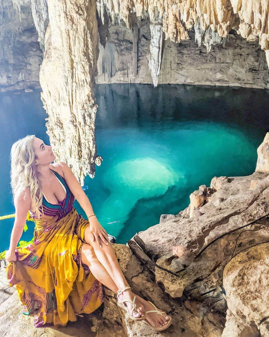 アリサ・ラモスのインスタグラム：「Another classic Expectations vs Reality thanks to the vagueness of many social media posts 😂 Had my heart set on getting this iconic shot, except with me standing on the platform in the middle of Cenote Suytun... . Drove 2 hours and stayed the night in Valladolid to be the first ones there when it opened at 9am, and we were! BUT! . Turns out the platform was 20 feet under water (yet still so clear that you can see it perfectly), and it's only above water during certain months of the year! They said it will be under water until next year! . They also informed me that the beam of light you see in the viral photos from here is usually seen in June, so save this post if you want to remember all this!! . Regardless of my photo-dreams being squished, Cenote Suytun was still very cool to see, and unlike many of the other Cenotes I've seen! Plus it was only $7 so I wasn't that upset (most of the popular ones near Tulum and Playa are $15-30!). . Best of all though was discovering how adorable Valladolid is! Every building is a different bright color, and the architecture is colonial! Definitely worth staying a night or two! Especially since a decent hotel is only around $20! . This little roadtrip has instantly cured the funk I was in last week, hope it encourages you to take a mini getaway as well! . How do you feel about all the Cenotes I'm showing? Creepy or cool?? . . #cenotes #cenotesuytun #valladolid #quintanaroo #mexico #MyLifesATravelMovie #instagramvsreality #tlpicks #beautifuldestinations」