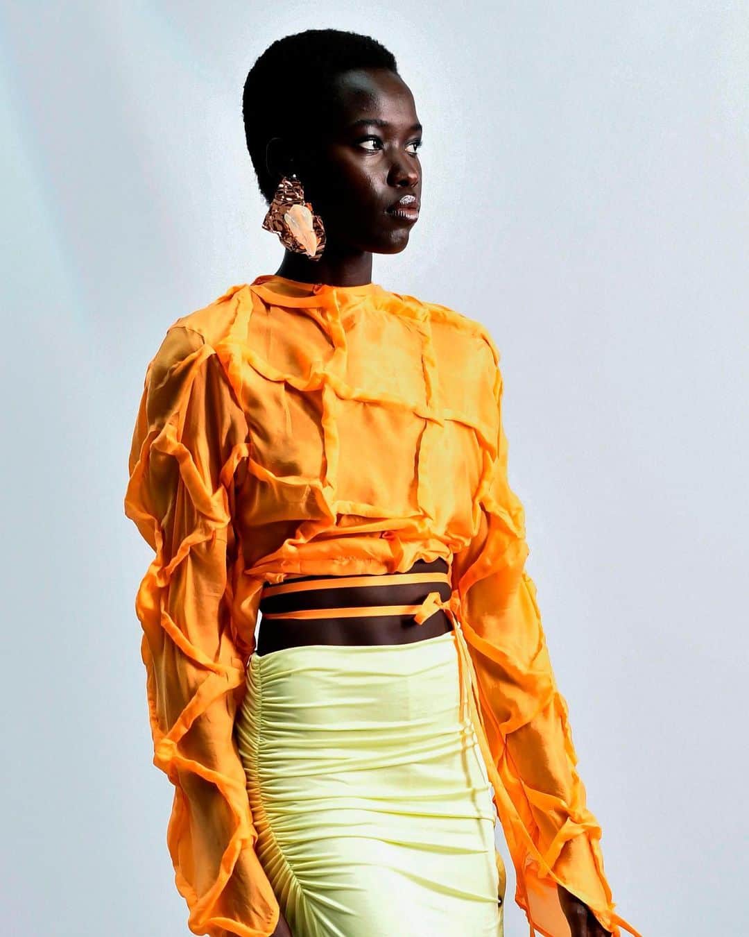 Fashion Weekのインスタグラム：「Orange crush 🧡 @acnestudios Spring/Summer 2021, photographed by @gettyimages」