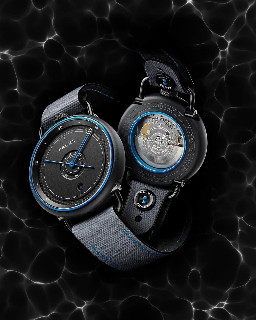 ボーンメルシーのインスタグラム：「Take a deep dive into the world of the new Limited Edition BAUME OCEAN in collaboration with Waste Free Oceans (WFO) and SEAQUAL INITIATIVE - A representation of balanced design, technical expertise and a unique vision of watchmaking.   The Baume Ocean is equipped with a watch case and interchangeable strap both made from recycled PET. Eco-responsibility and innovation are at BAUME’s core with 5% of all sales going towards marine pollution emphasizing the importance of the five oceans in our daily lives.  Check the link in our bio to get your environmental hands on one of our BAUME OCEAN Limited Edition pieces.  -- BAUME 10587 Automatic – Date, 42 mm marble grey recycled polypropylene and blue anodized aluminium case, Interchangeable grey woven recycled PET strap with blue stitching, 38-hour Power reserve.  -- #baumeetmercier #baumeocean #swissmade #sustainable #design #naturalmaterials #recycled #wastefreeoceans #seaqualinitiative」