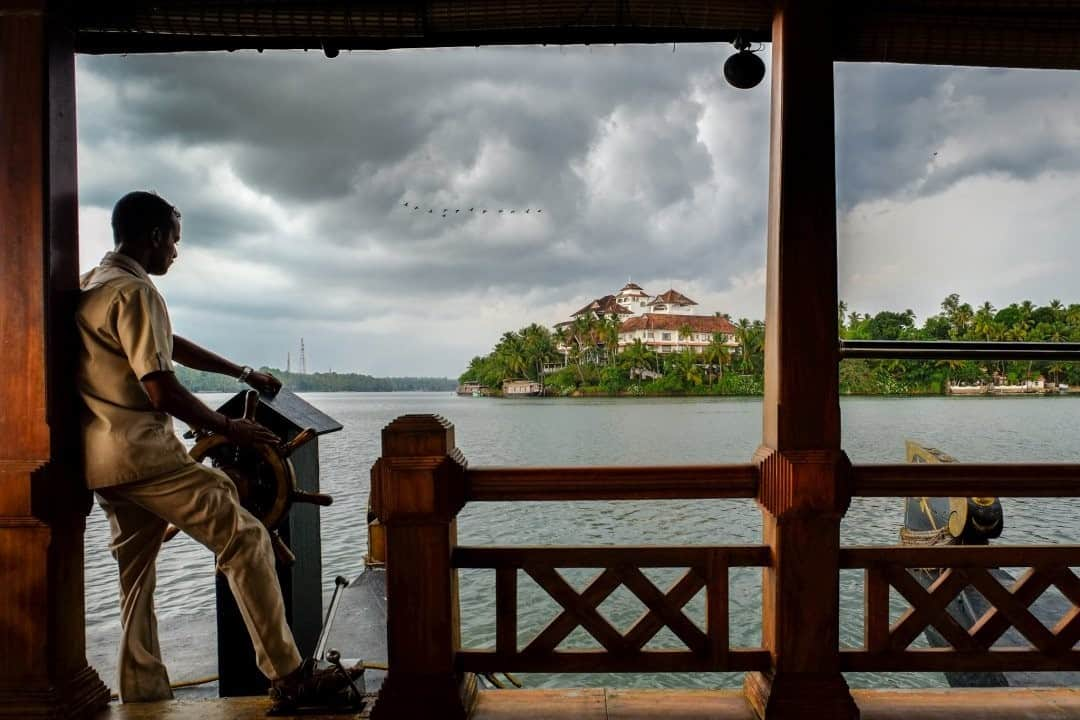 National Geographic Travelさんのインスタグラム写真 - (National Geographic TravelInstagram)「Photo by @francescolastrucci / A storm approaches as a houseboat crosses the Ashtamudi Lake in Kerala. It is one of the biggest lakes in India and the gateway to one of the best backwater routes in the region. Meaning “eight cones” in the local Malayalam language because of its topography and its eight branches resembling a palm tree, Ashtamudi Lake is known for its unique wetland system and rich biodiversity. I photographed a series of images of the backwaters immersed in a dreamlike environment: the colors of the nature, the mirroring placid waters, and the echoes of the chants coming from the surrounding temples.  Follow me @francescolastrucci for more places, daily life, and stories around the world. #india #kerala #backwaters」11月13日 0時37分 - natgeotravel